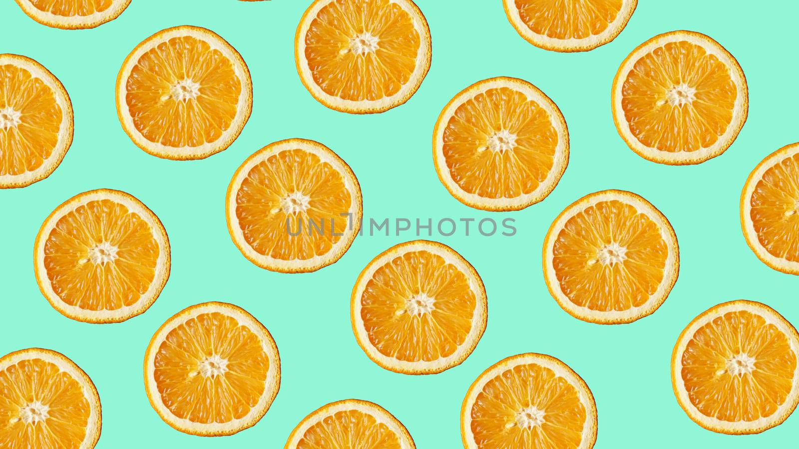 Colorful fruit pattern of fresh orange slices on modern blue background. From top view