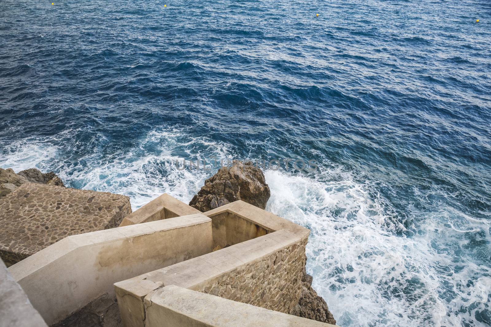 Steps to the sea in Monaco, sunny day.