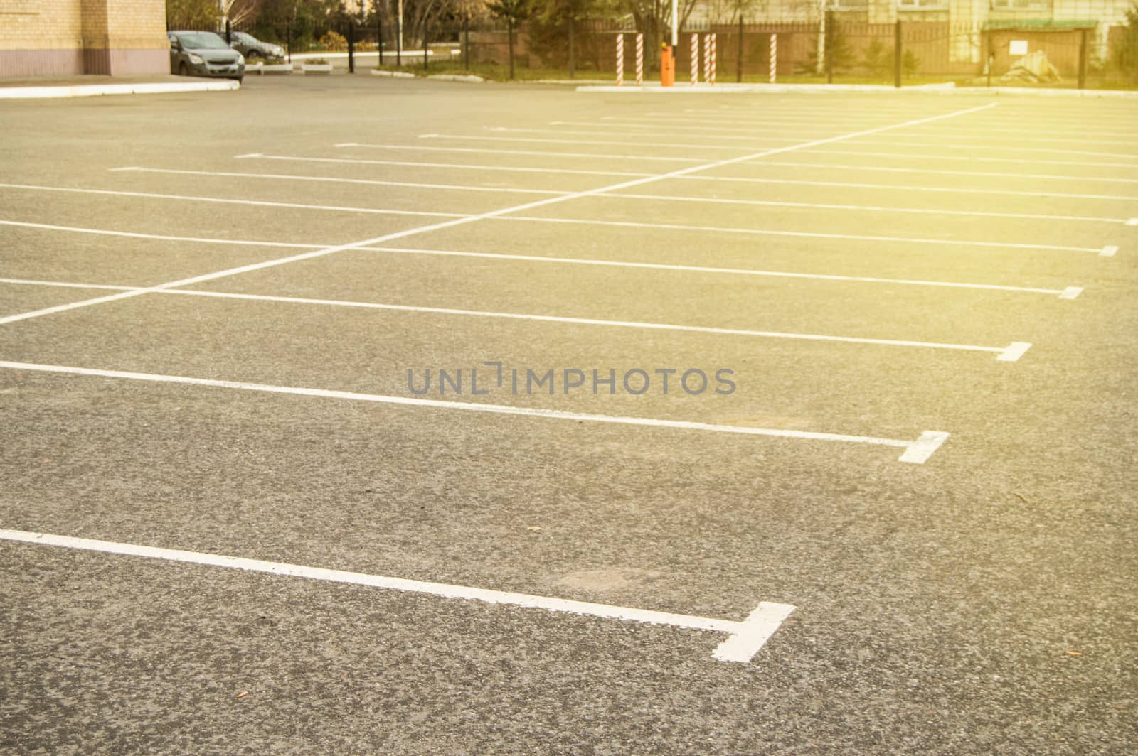 Road marking on an empty asphalt Parking lot, a copy of the space, mockup by claire_lucia