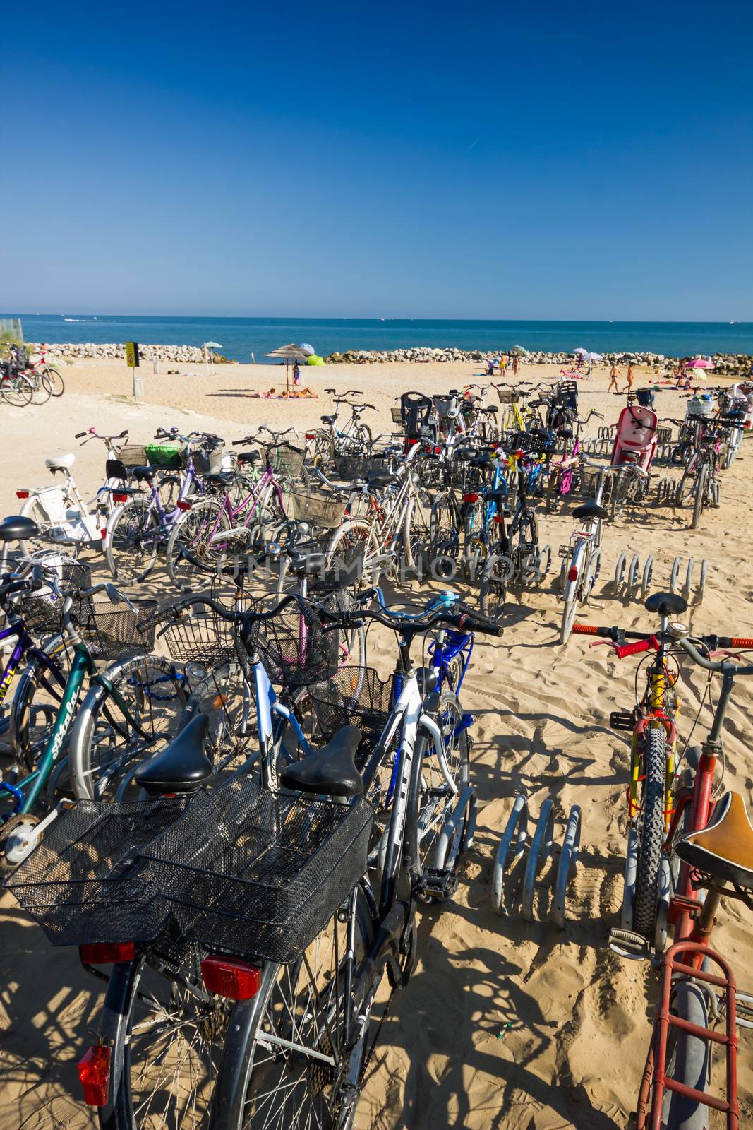 A lot of bicycles near the sea, sunny day, ble sky