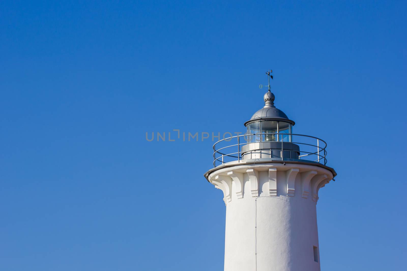 Top of the lighthouse with nice blue sky in background