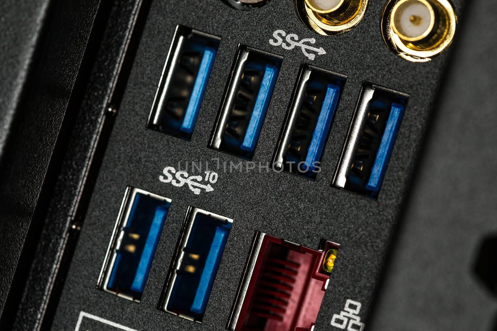 Close up of input output panel in the back of a desktop computer with USB 3.0 ports