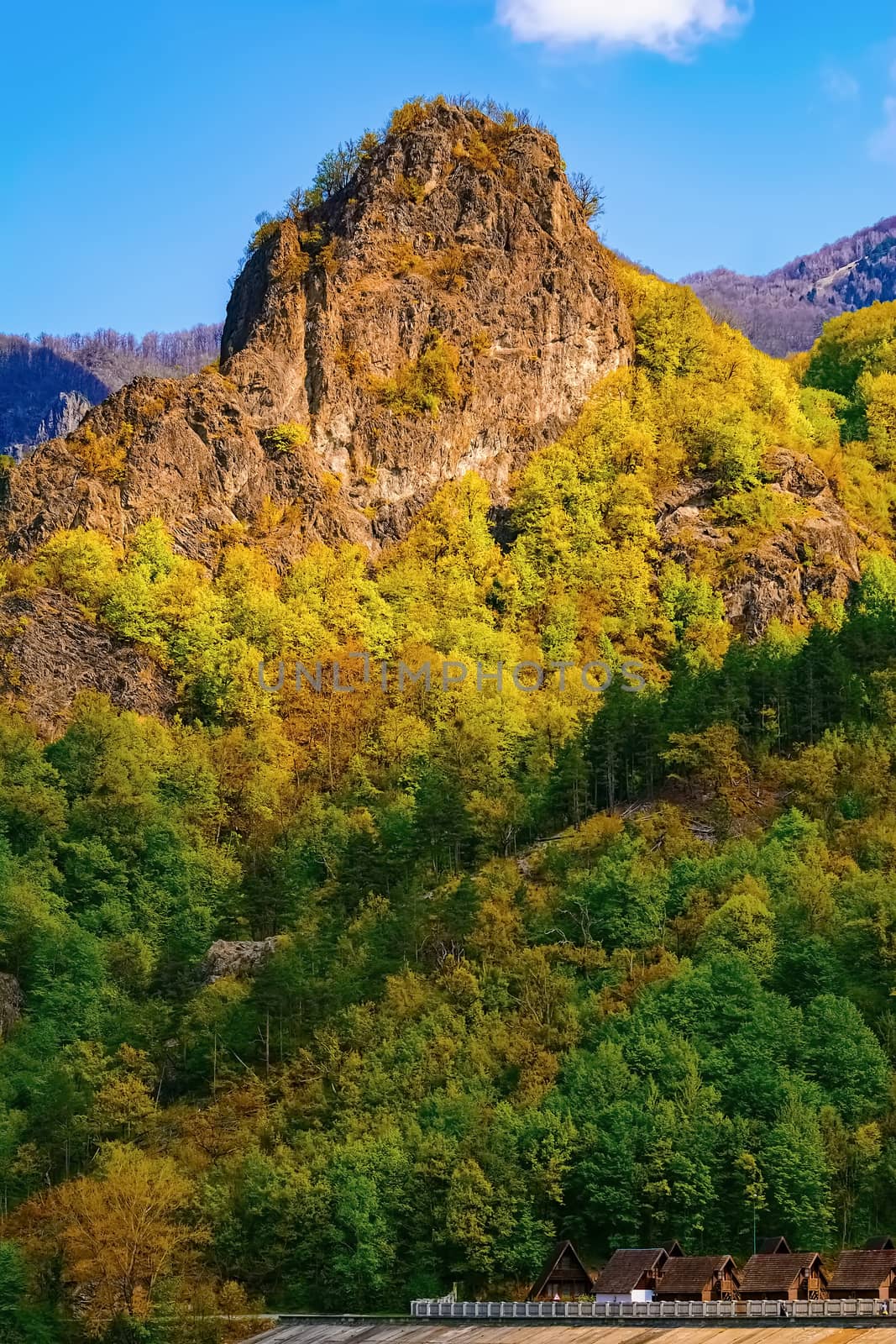 Carpathian mountains under blue sky in Romania