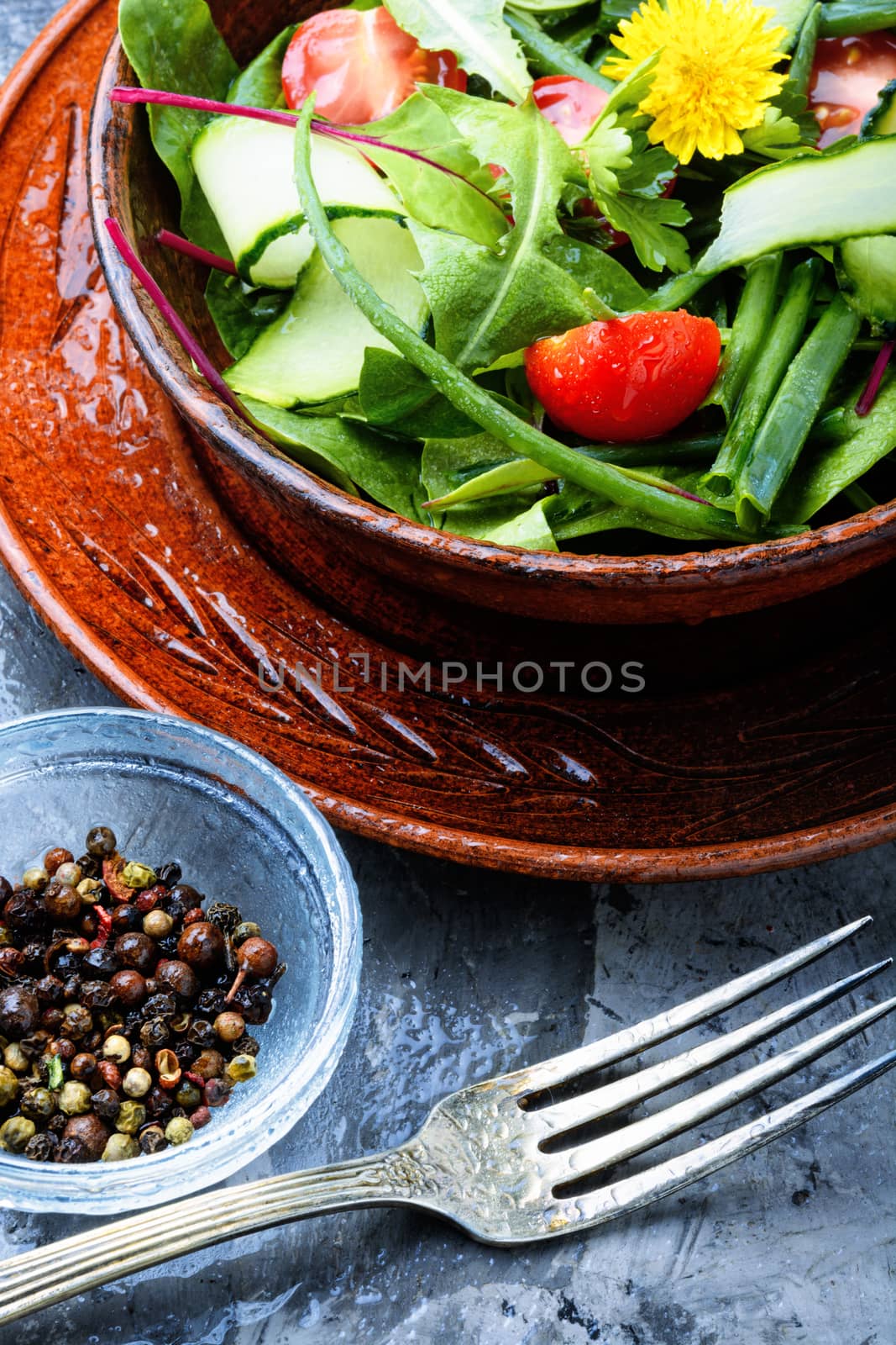 Healthy vegetable salad of fresh tomato, cucumber, herb and lettuce