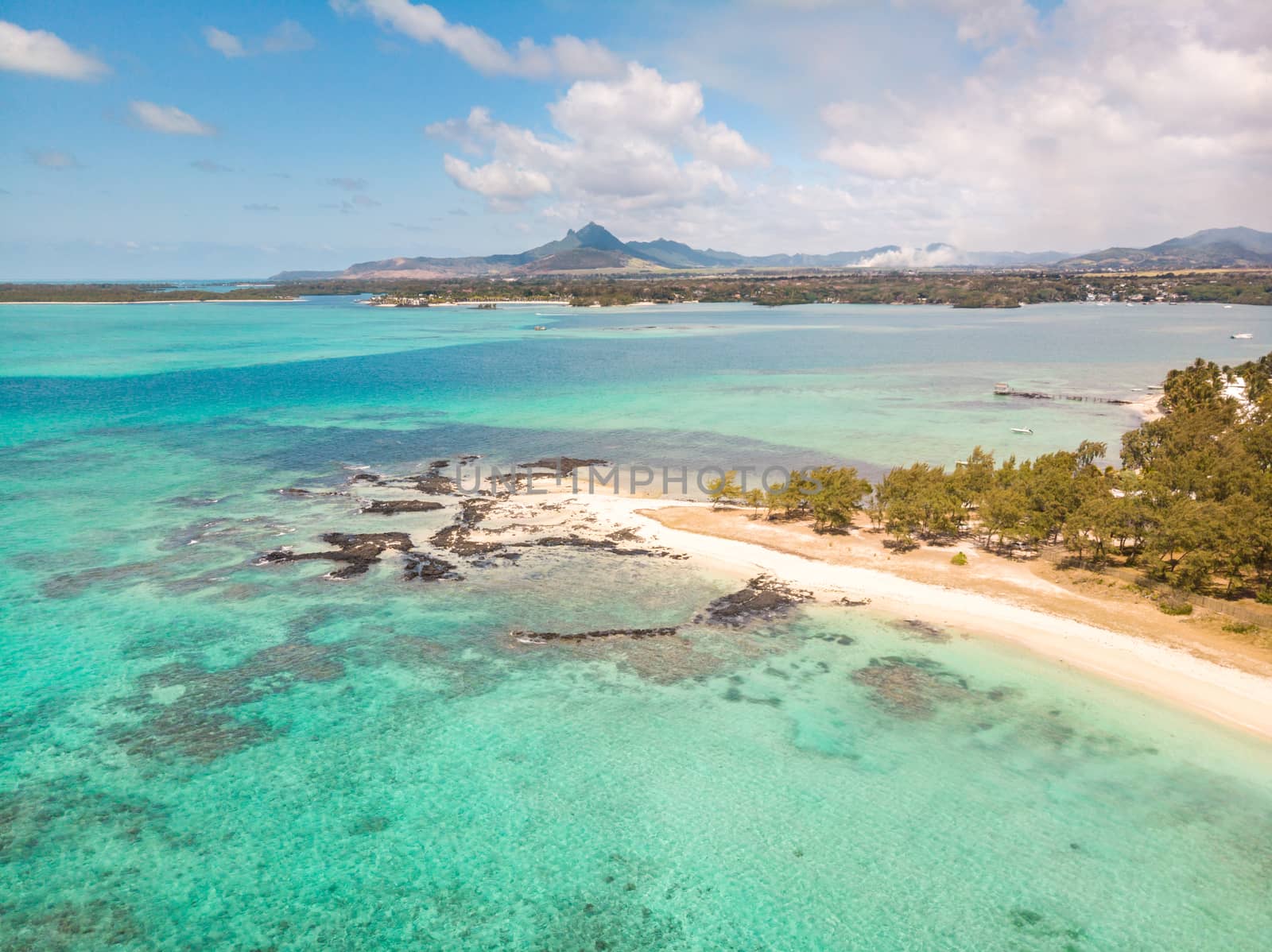 Aerial view of beautiful tropical beach with turquoise sea. Tropical vacation paradise destination of D'eau Douce and Ile aux Cerfs Mauritius by kasto