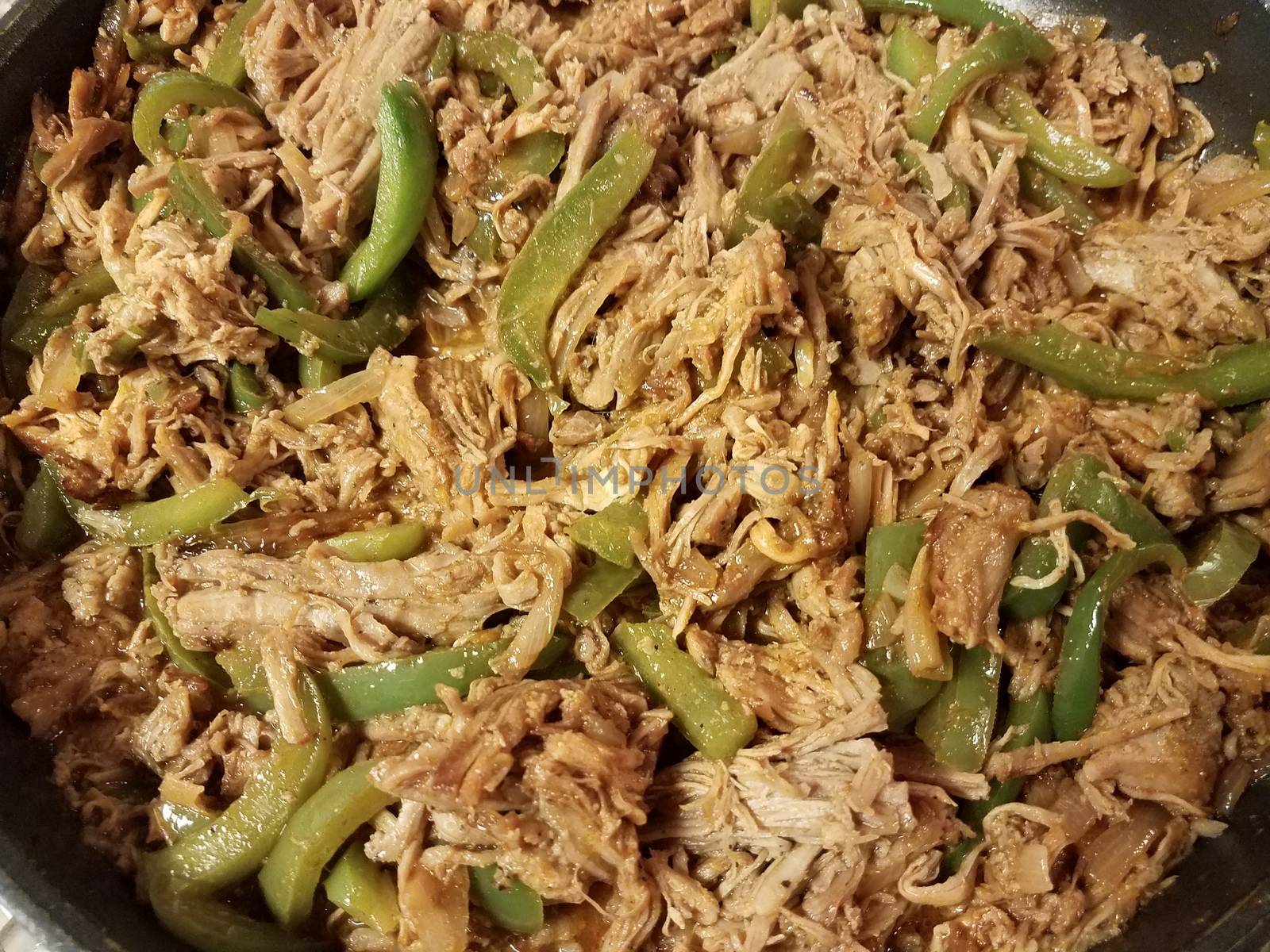frying pan with pulled pork and green peppers by stockphotofan1