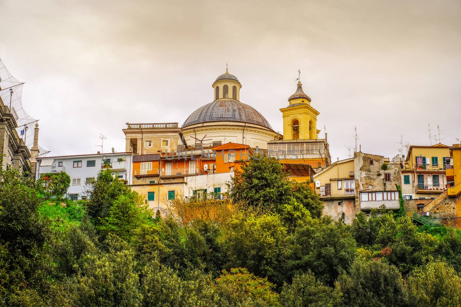 Ariccia - rome suburb in Lazio on Castelli Romani the cupola dome of Santa Maria Church with village skyline .