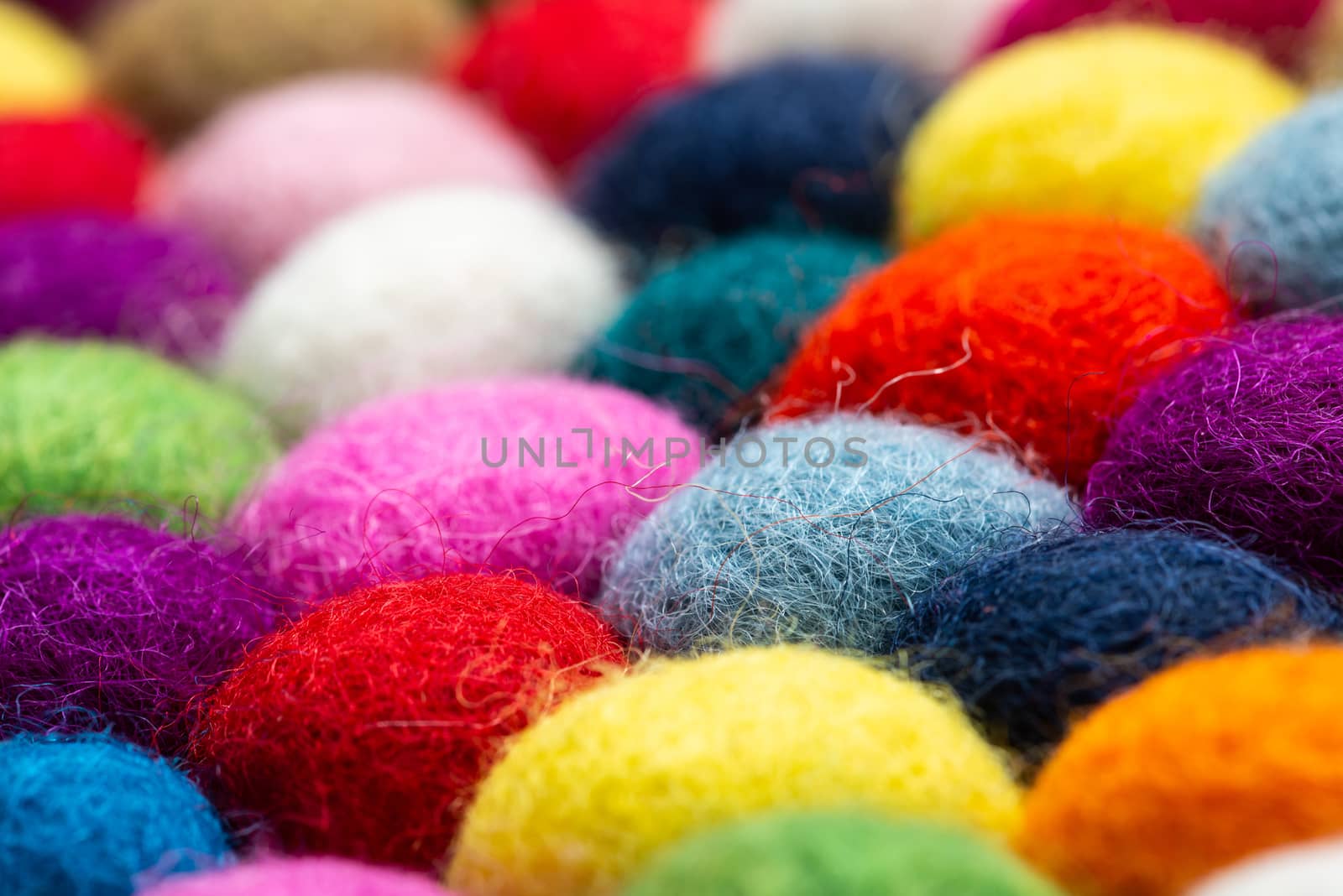 Multicolored felt ball rug detail by dutourdumonde