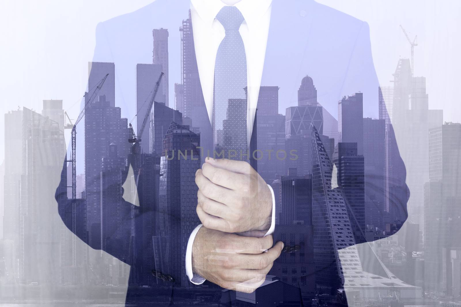 Corporate business, entrepreneurship and economic prosperity conceptul collage. Businessman wearing fashionable classic navy blue suit against new york city manhattan buildings and skyscrapers.