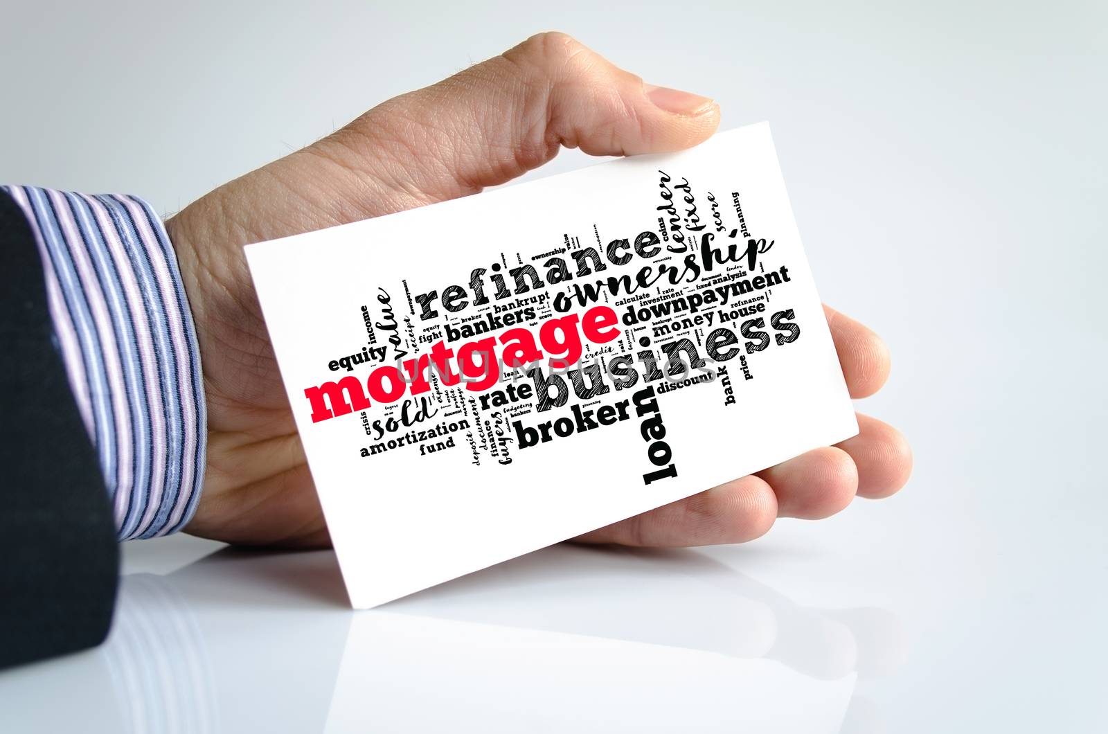 Mortgage word cloud collage over note in human hand
