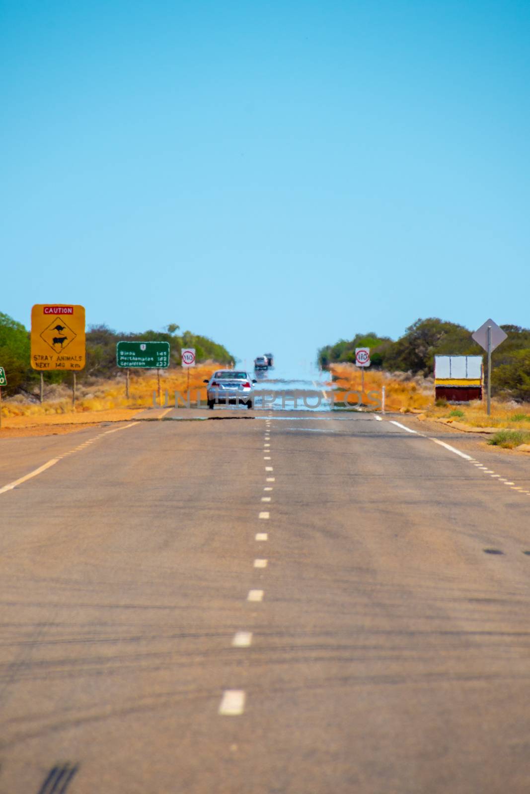 Mirage on an endless straight road in Western Australia