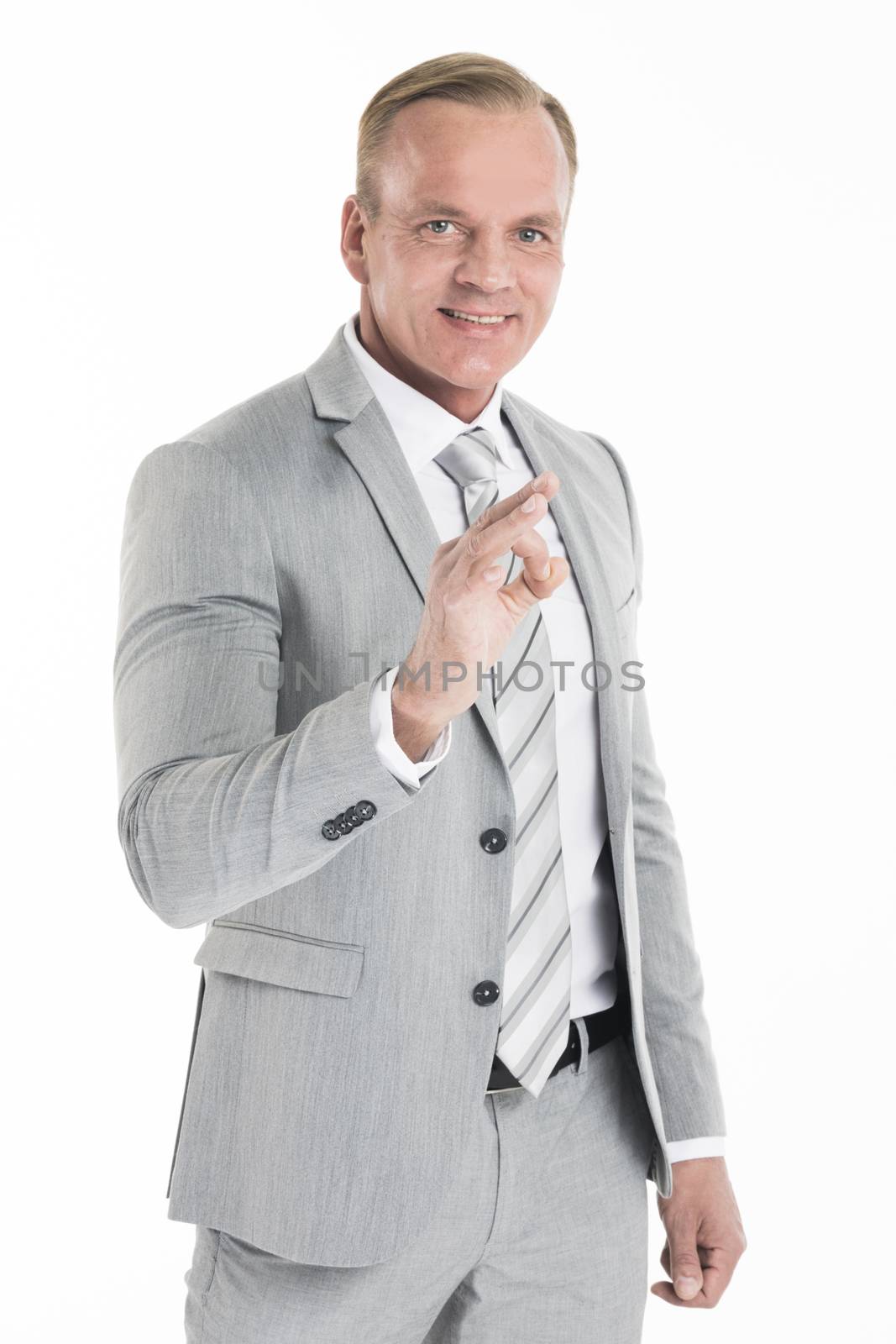 Mature businessman doing ok sign, isolated over white background