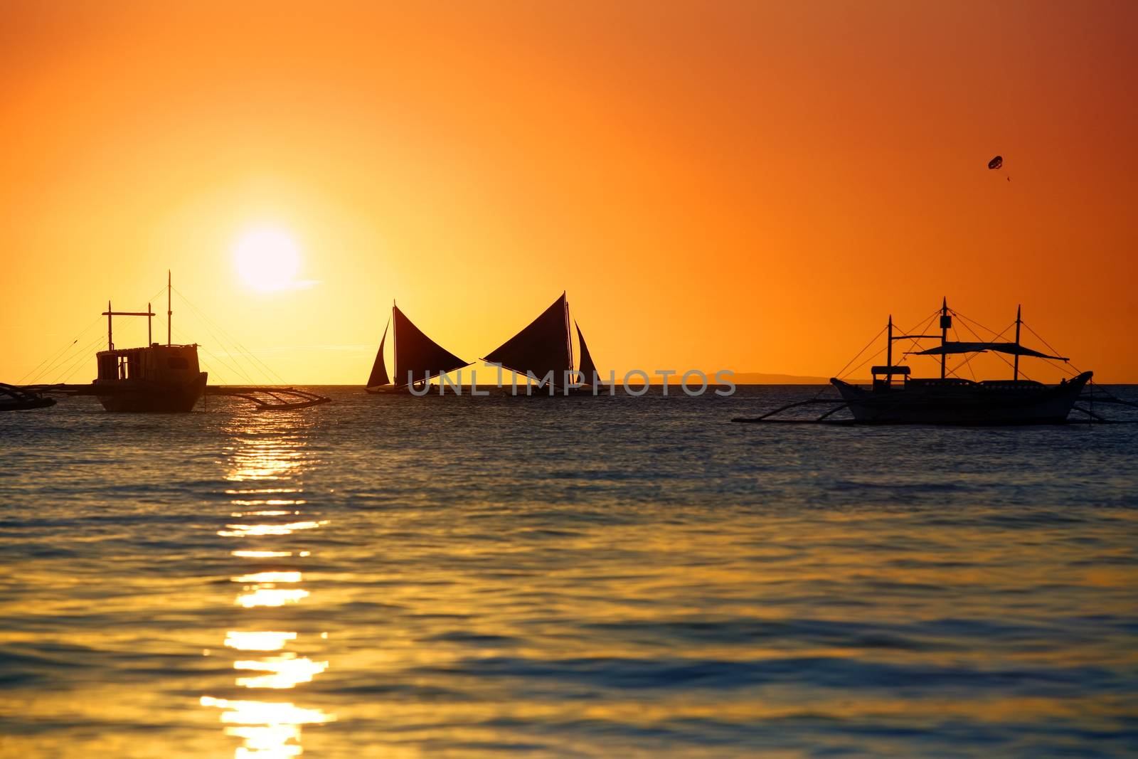 Traditional Philippine boats on sunset. Island Boracay by friday