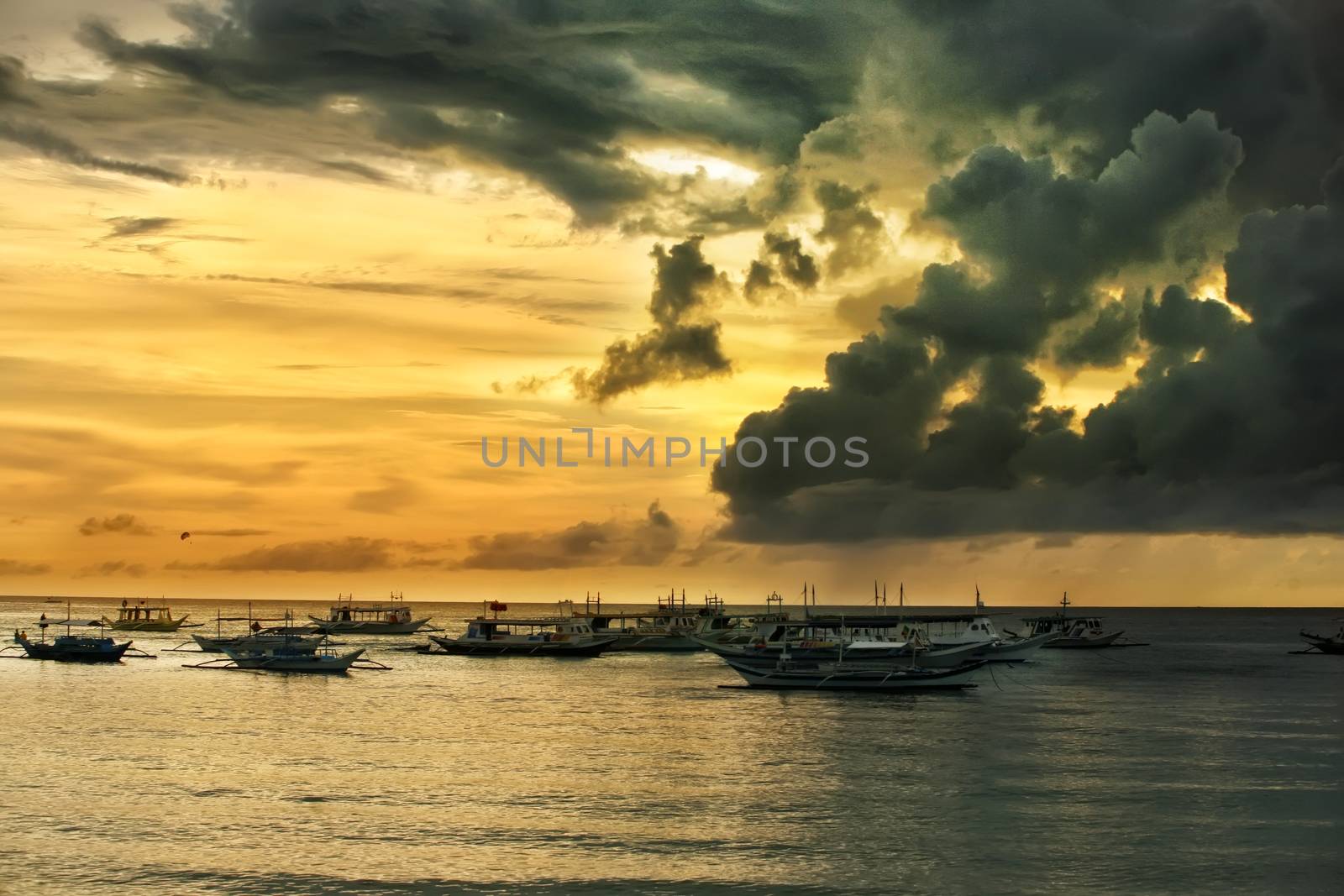 Traditional Philippine boats on sunset. Island Boracay by friday