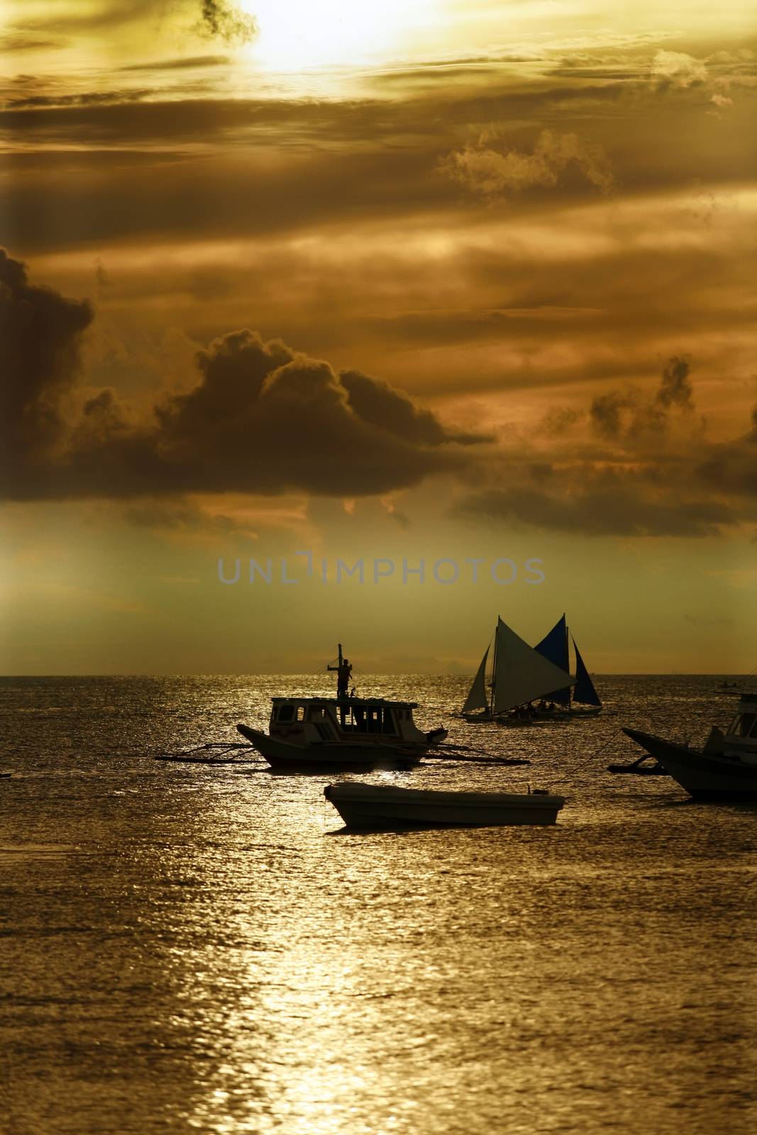 Traditional Philippine boats on sunset. Island Boracay by friday