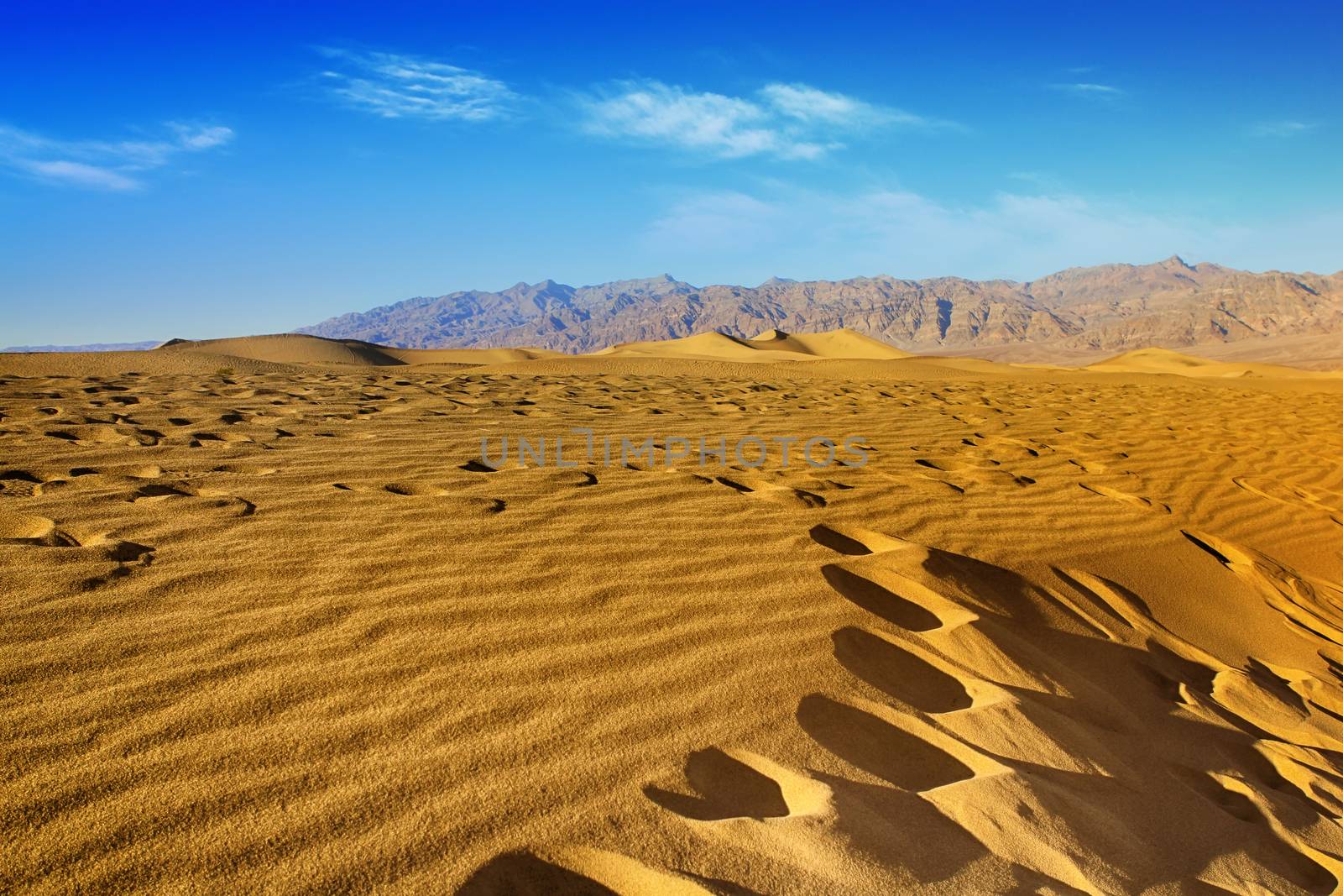 Ripples And Mountain Peaks. Death Valley National Park, Californ by friday