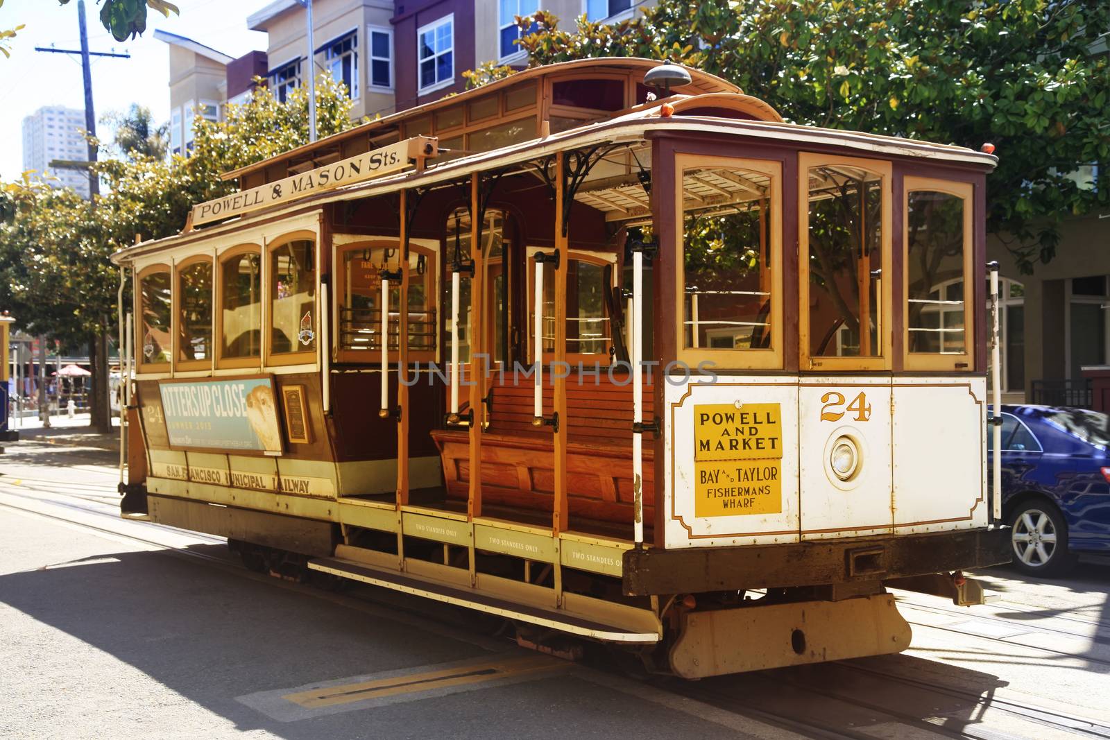 SAN FRANCISCO, CA, USA - AUGUST 17, 2013: Passengers ride in a cable car on August 17, 2013 in San Francisco. It is the most popular way to get around the City of San Fransisco which is in service since 1873.