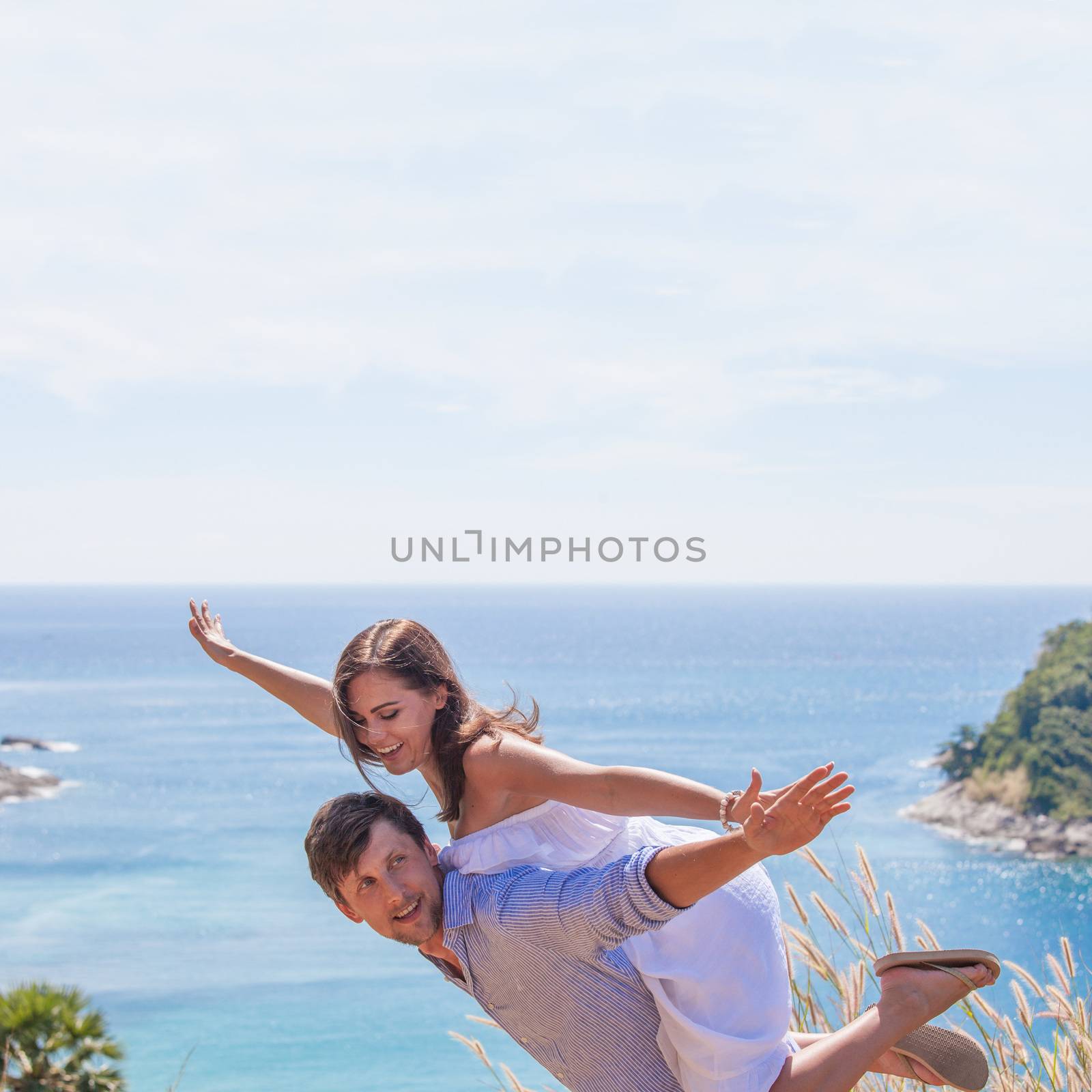 Happy smiling couple on vacation flying together