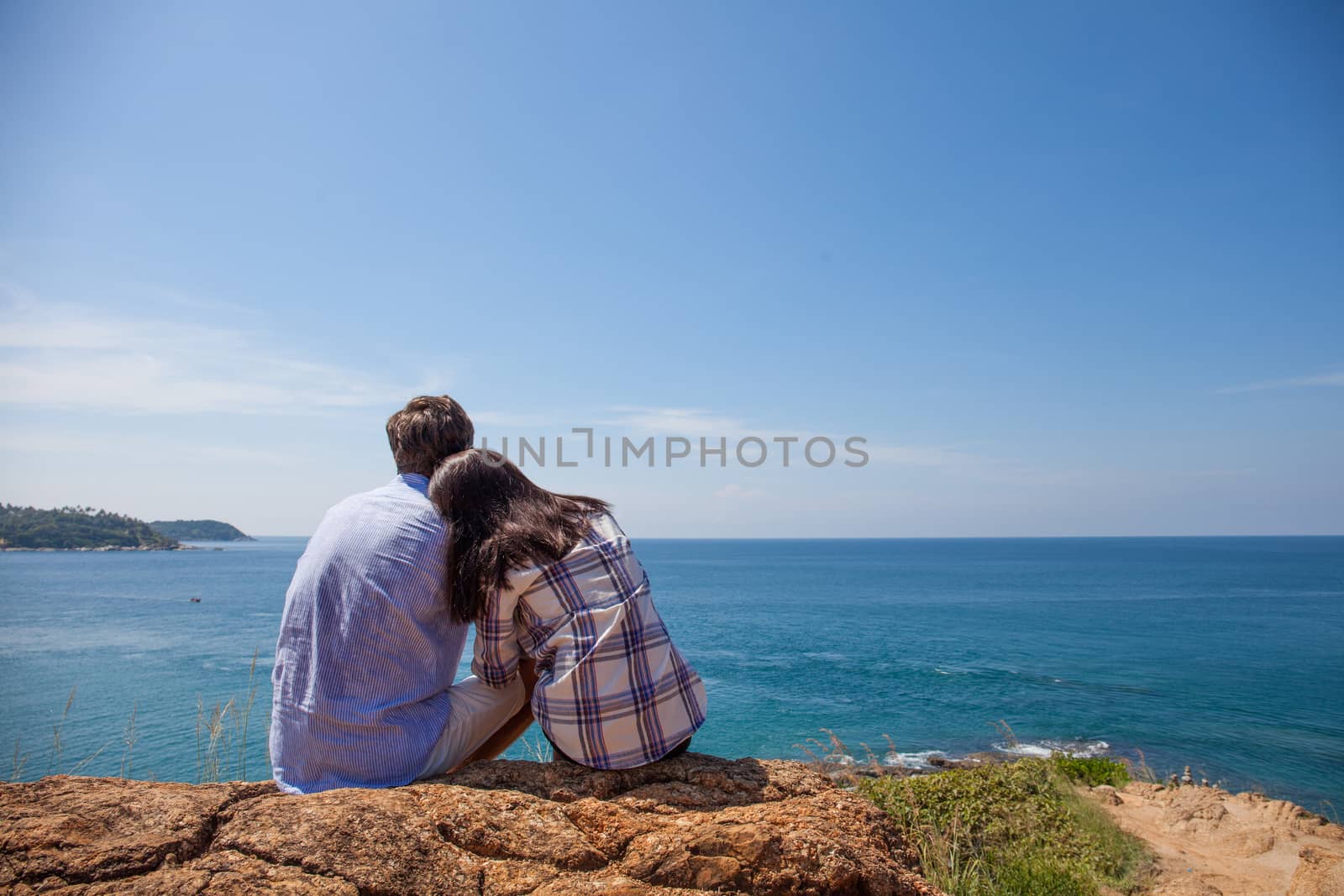 Young couple enjoy beautiful sea view on vacation