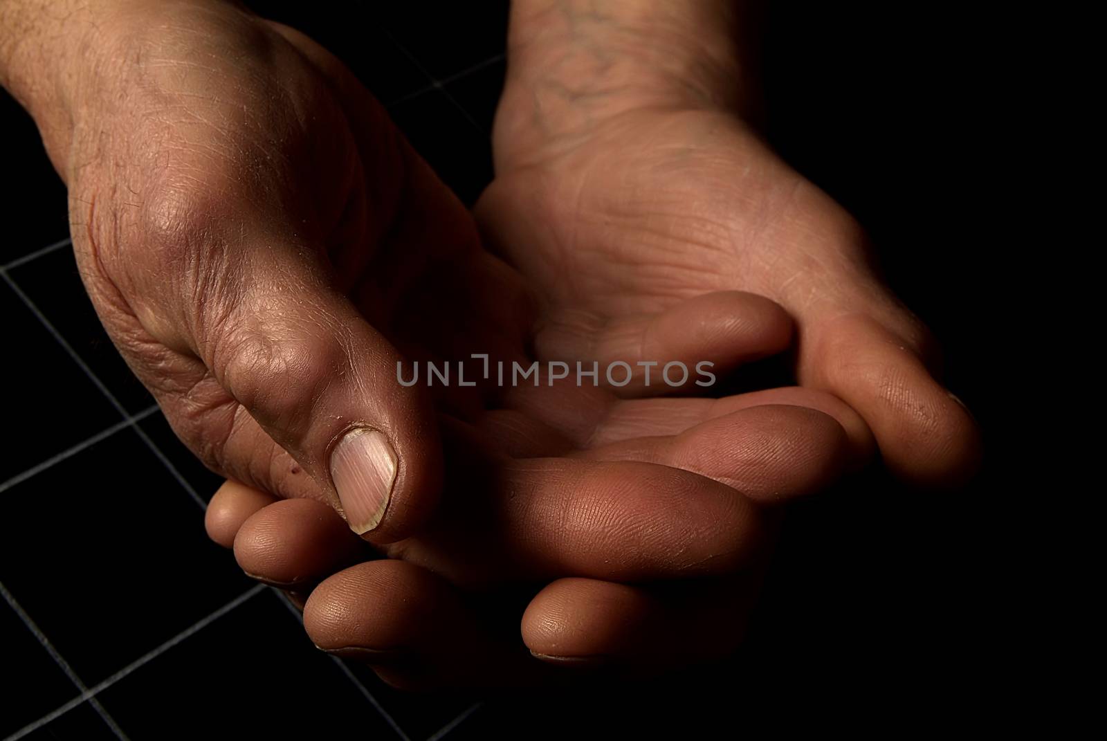 cropped view of people stacking hands during group therapy session in italy