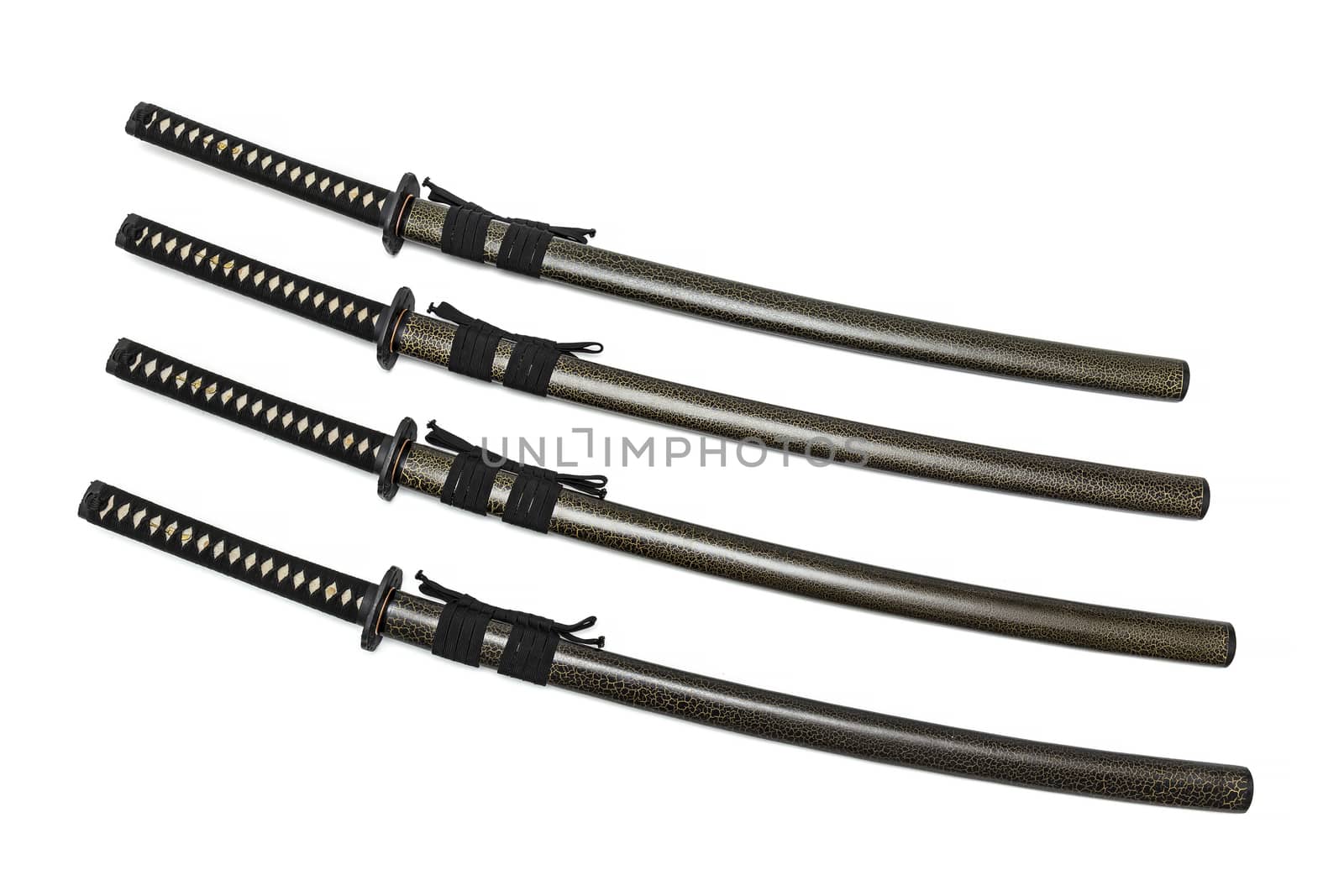 4 Japanese swords and green textured scabbard with black cord isolated in white background.