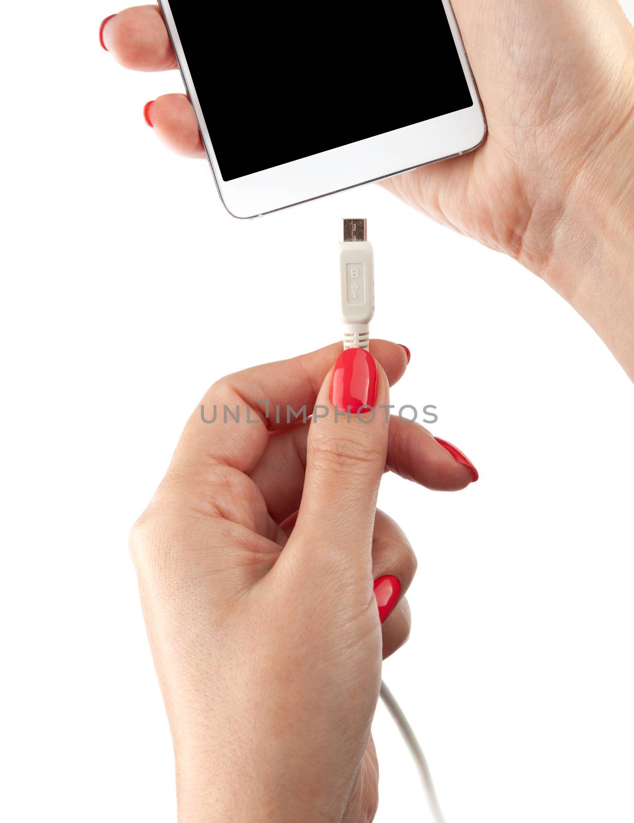 Smartphone in the hand of a woman. Connect the USB cable charger. Isolated on white background