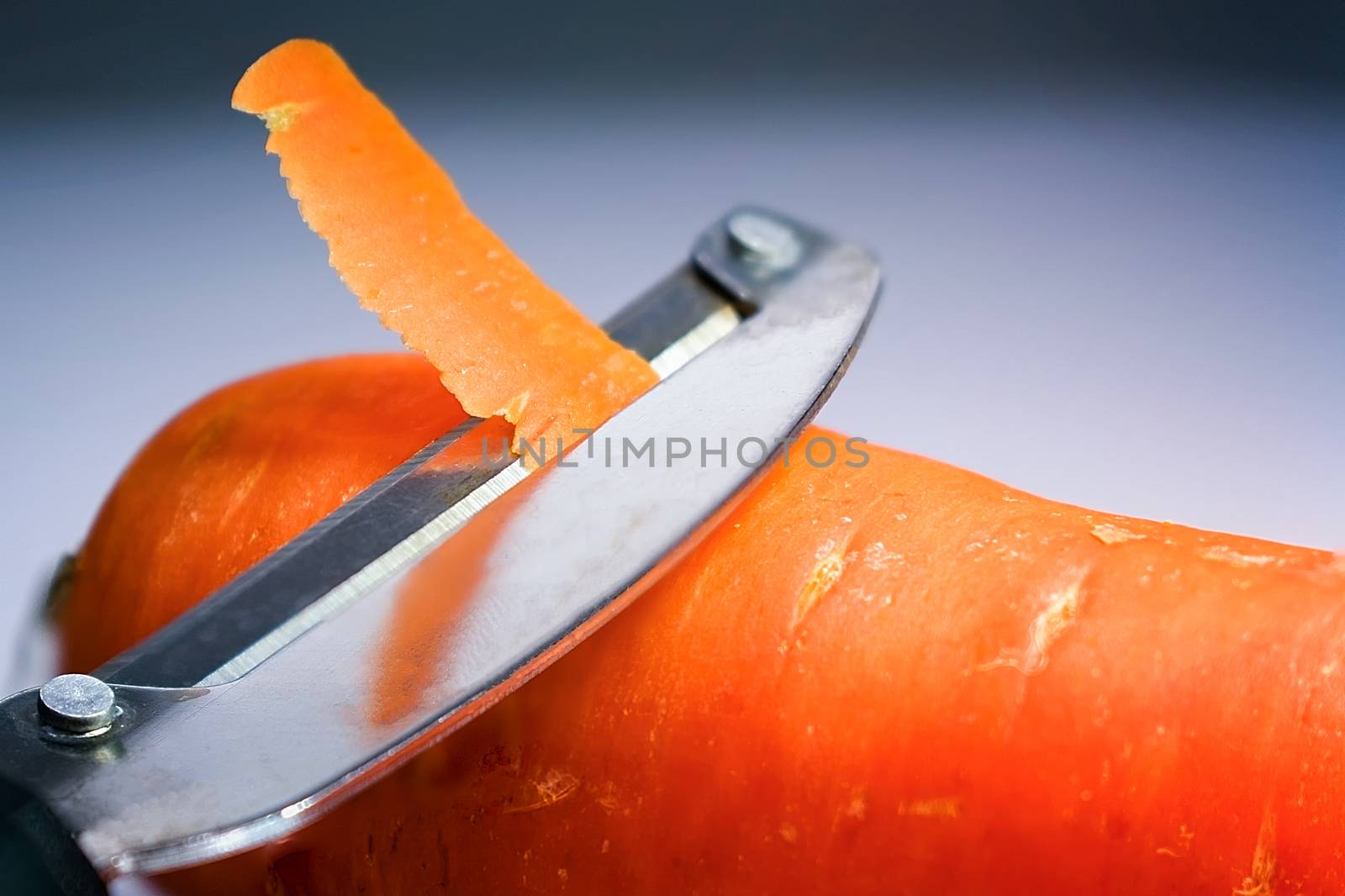 Peeler Peeling the Skin Off a Fresh Carrot