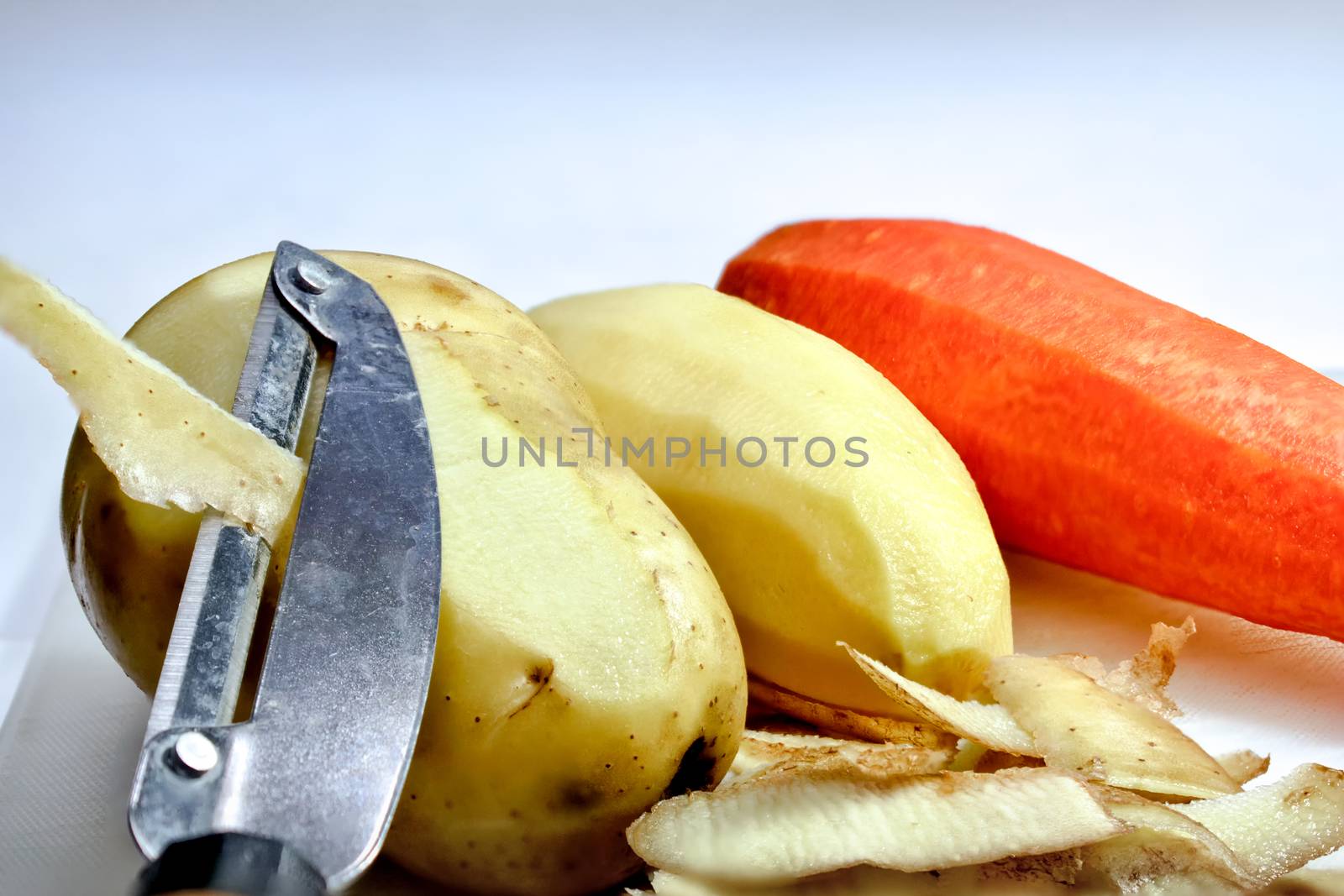 Peeled Potatoes and a Carrot during Preparation