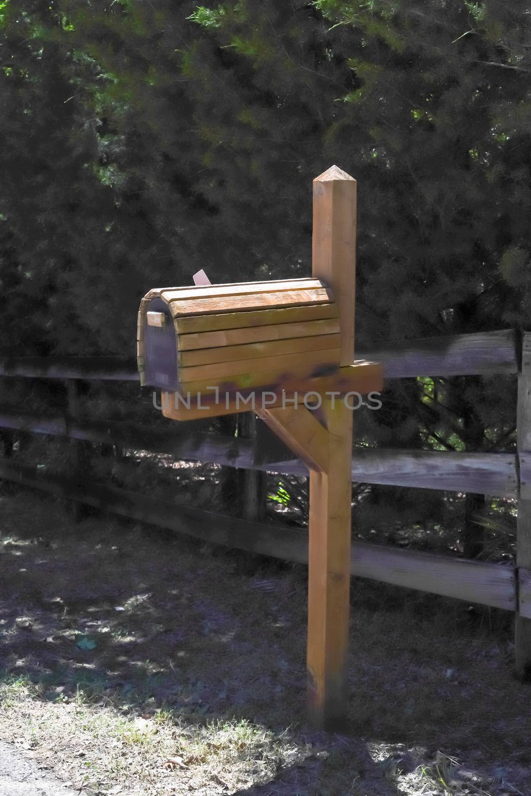 Close-up of wooden mailbox near farm fence in Texas, USA by trongnguyen