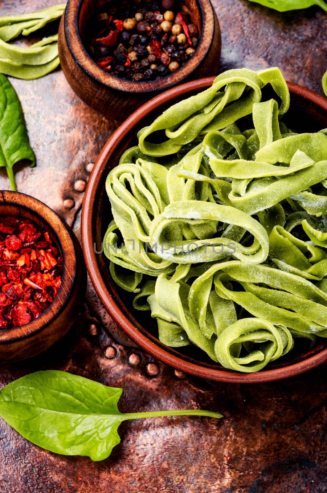 Spinach noodles.Handmade noodles and ingredients.Fresh uncooked noodles