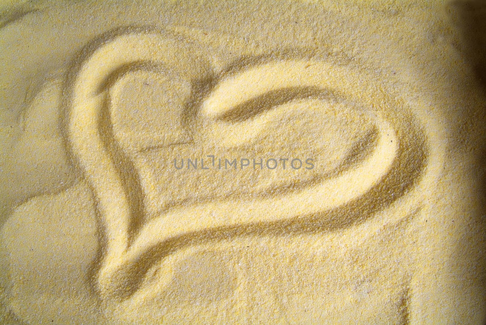 Heart drawn on sand, yellow by romeocharly