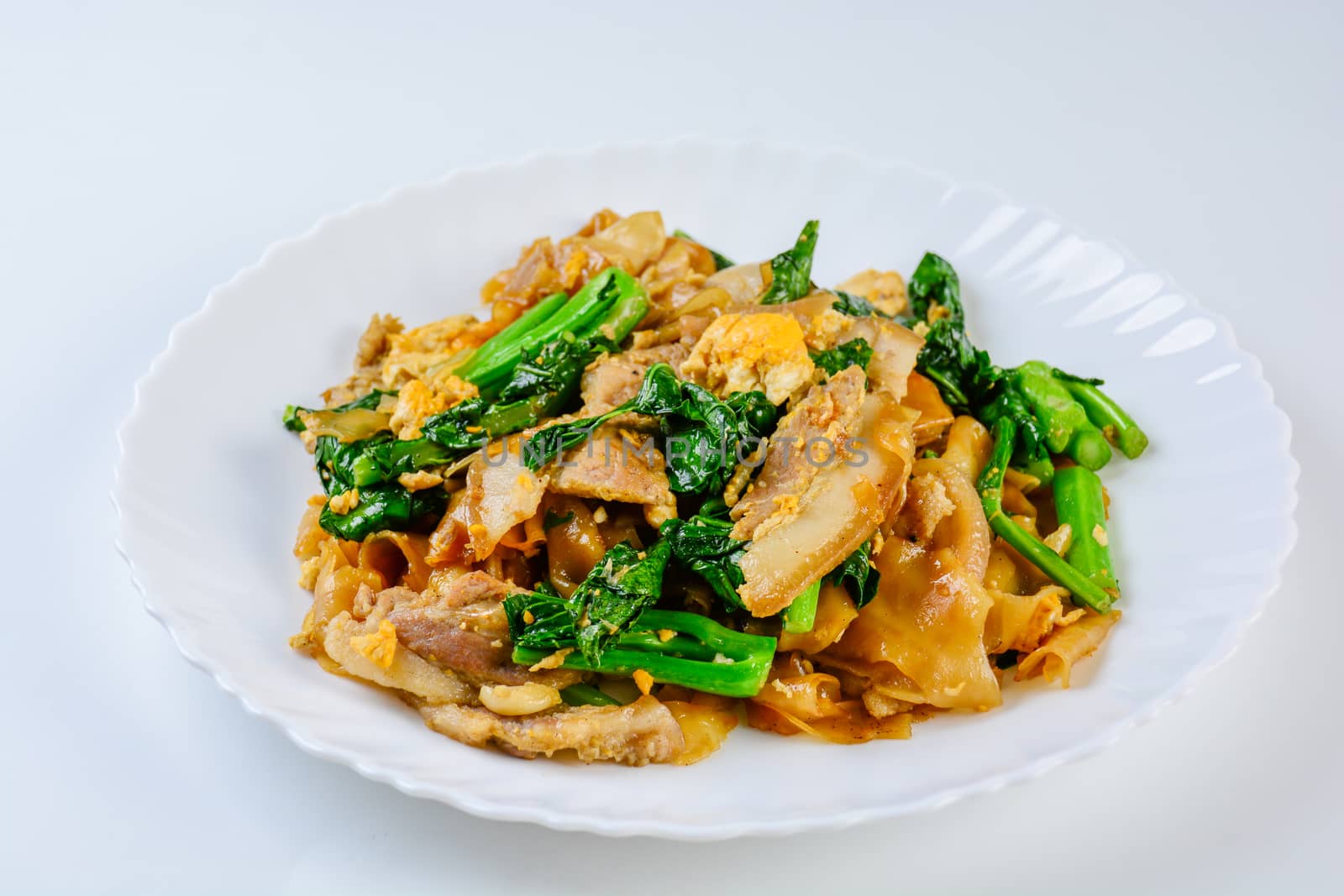 Stir-fried Fresh Rice-flour Noodles With Sliced Pork, Egg and Kale. Quick noodle stir-fry.