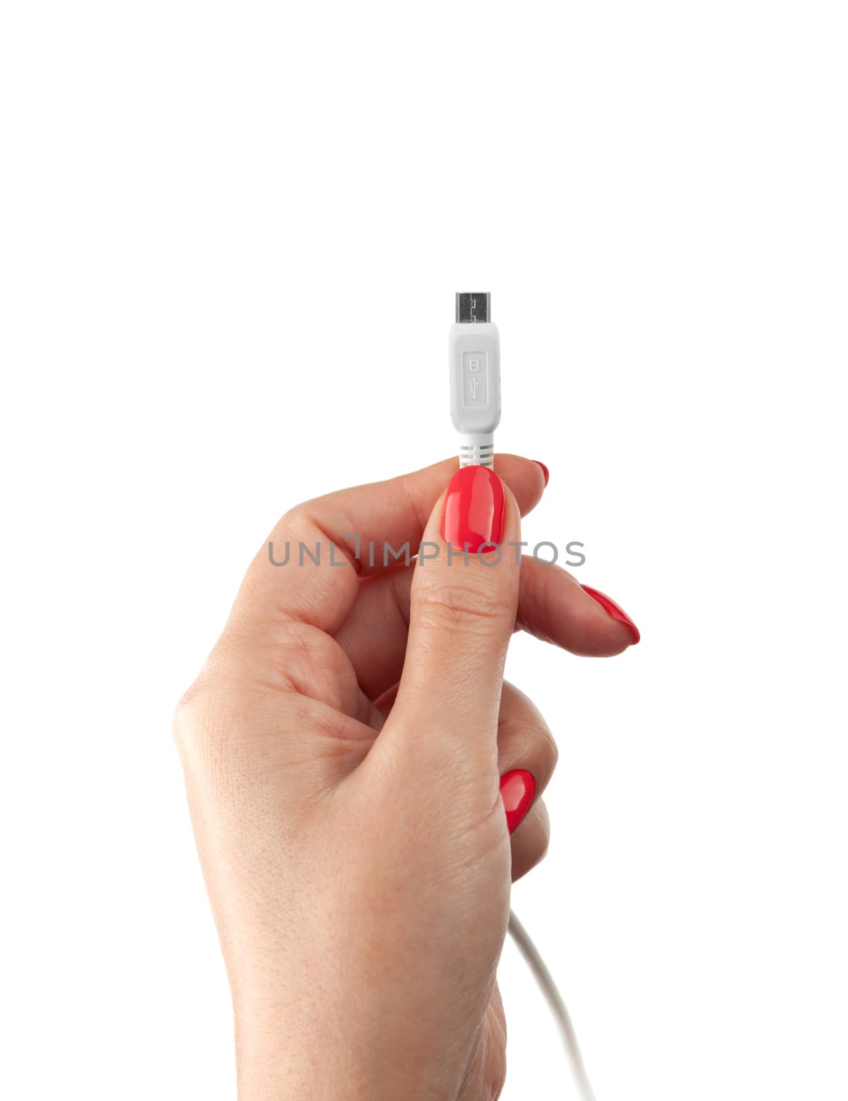 Hand holding USB cable. Female hand holding charging cable. Isolated on white background