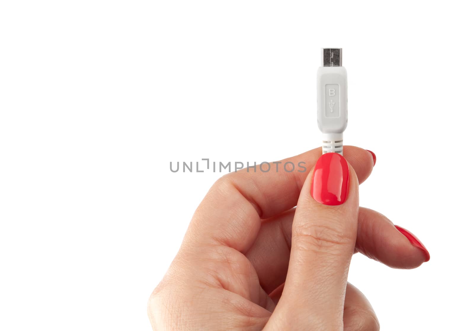 Hand holding USB cable. Female hand holding charging cable. Isolated on white background