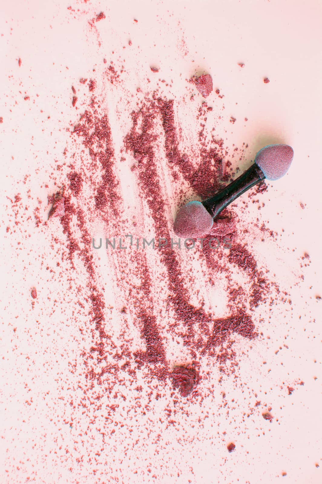 Scattered pink and coral eyeshadow with applicator, isolated on white background, beauty and makeup concept, vertical shot by claire_lucia