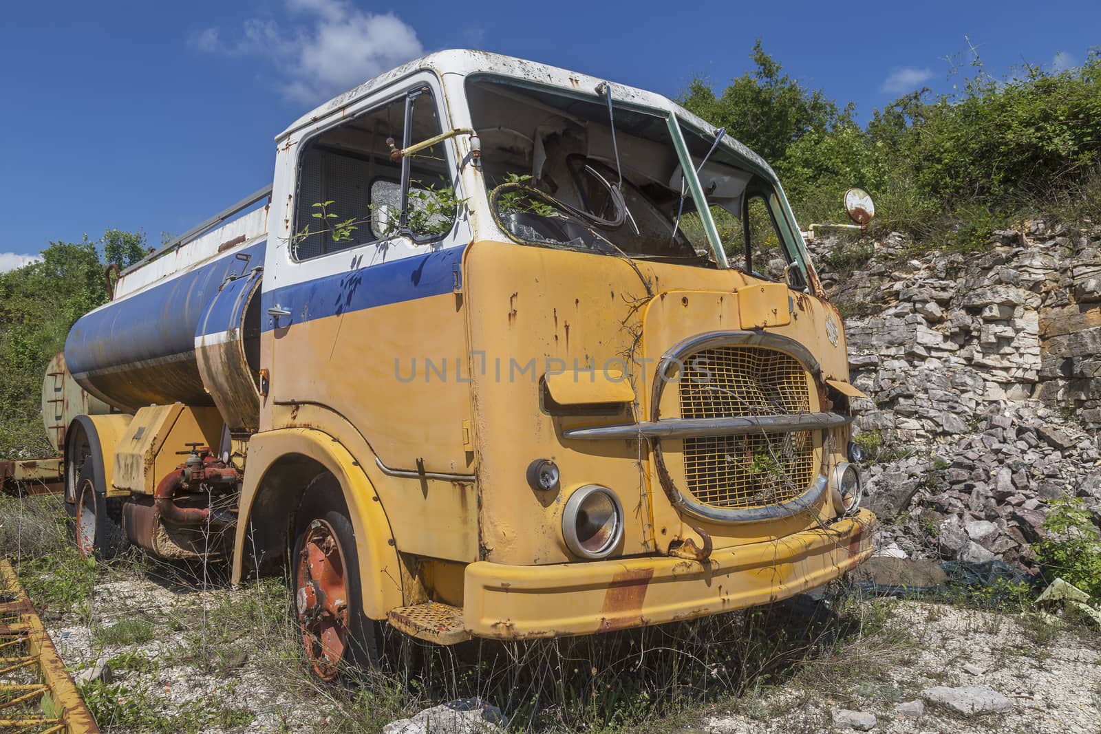 Old yellow truck by sewer12
