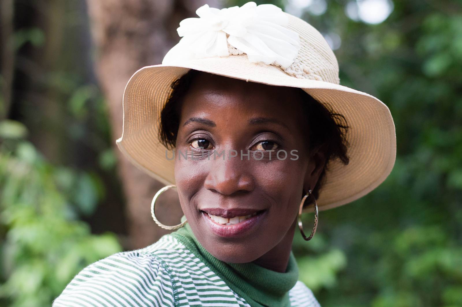 portrait of beautiful smiling woman on a walk in the bush.