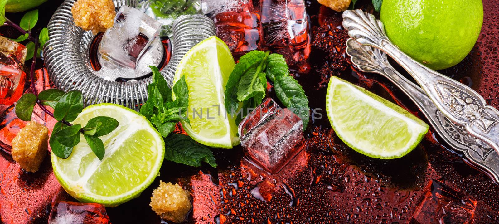 Mint, lime, ice ingredients and bar utensils