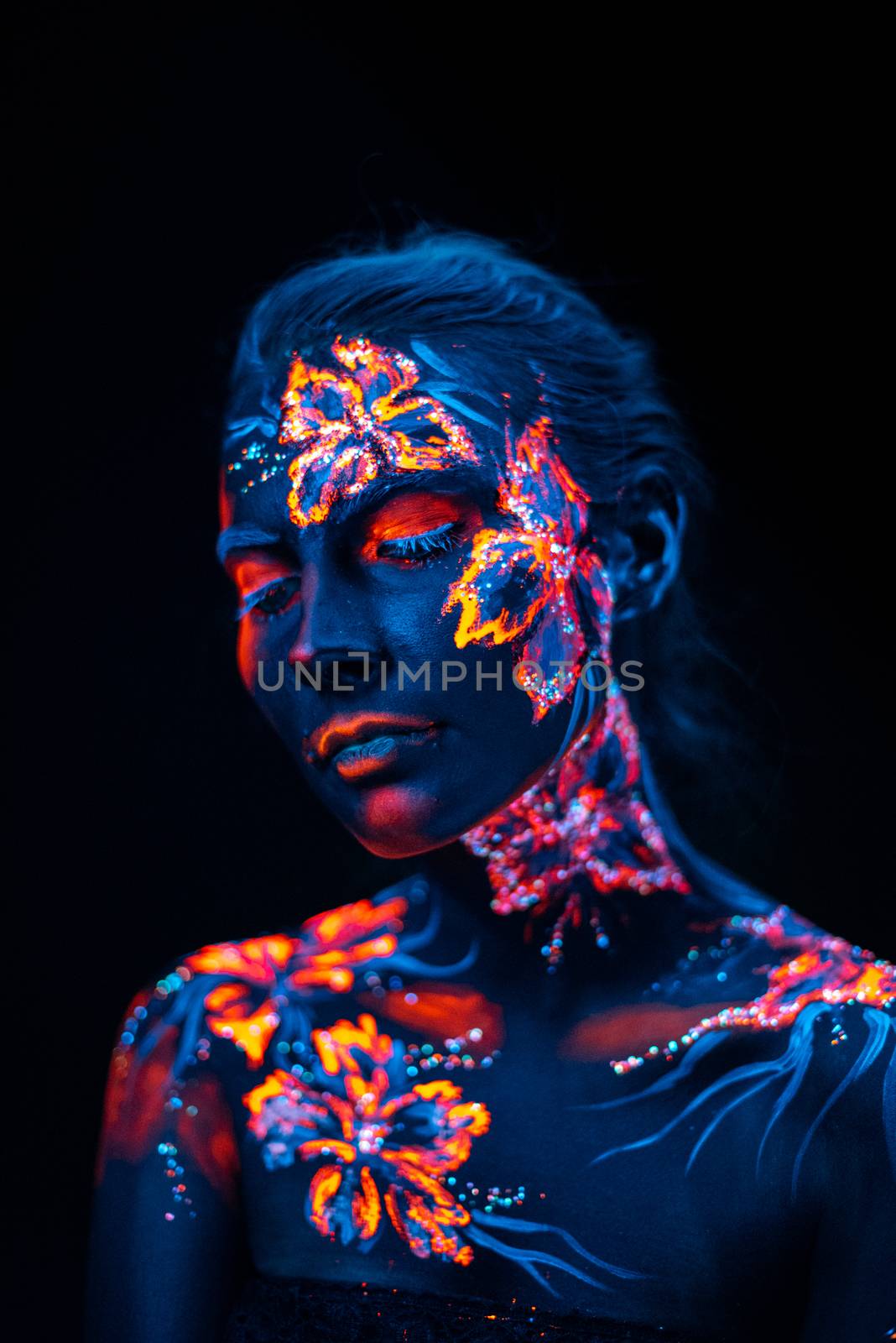 Beautiful flowers in UV light on a young girl face and body by Multipedia