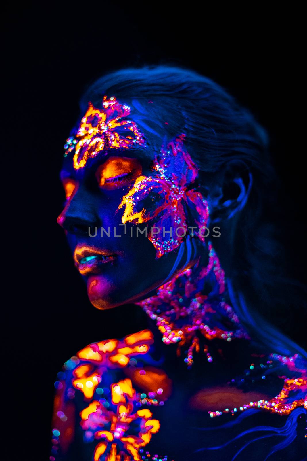 Beautiful flowers in UV light on a young girl face and body by Multipedia