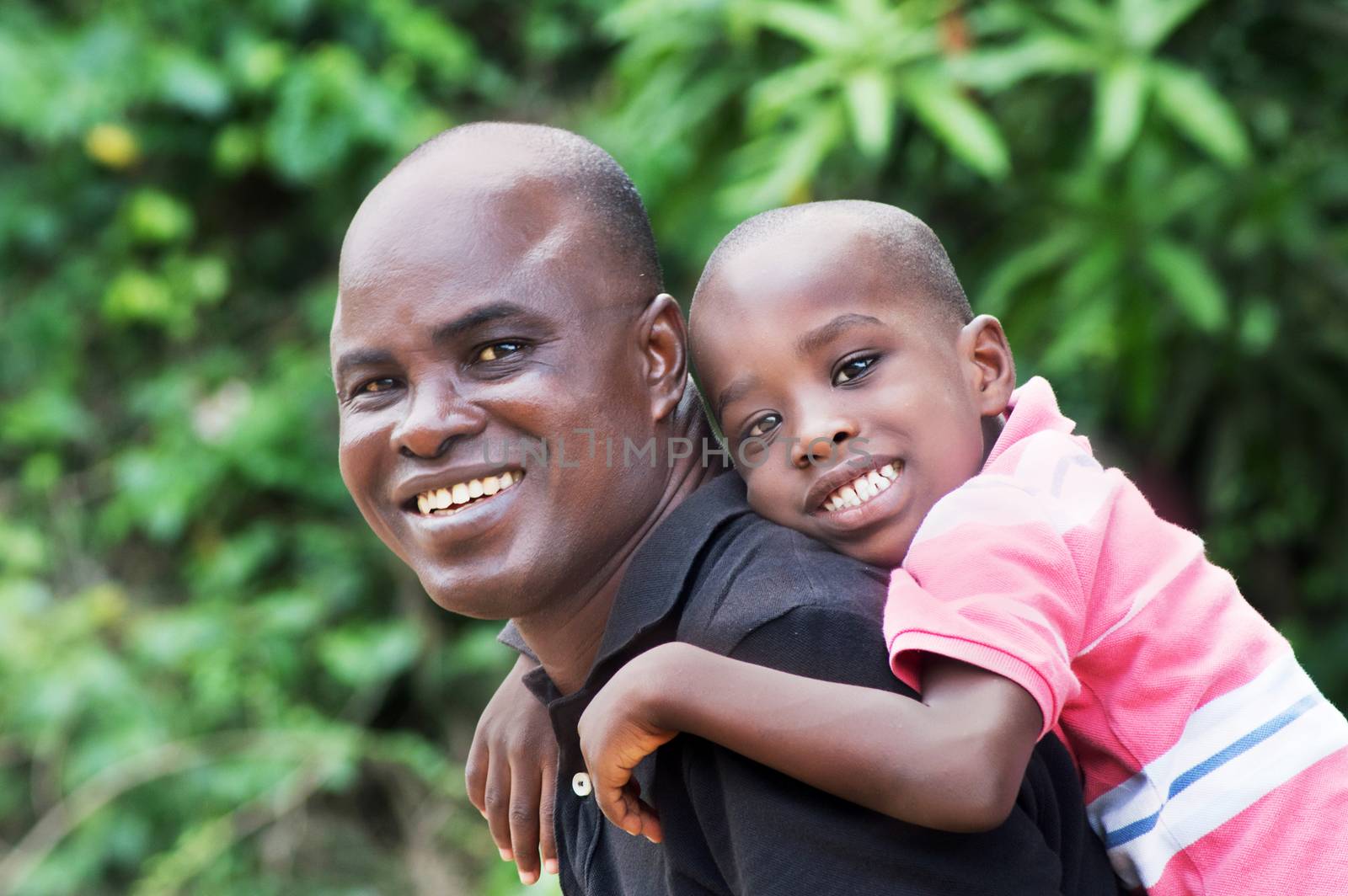 father and son are happy to walk together quietly in the countryside.