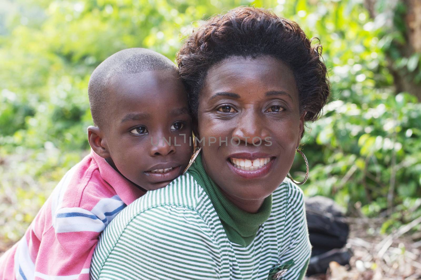 this happy mother carries her son on back