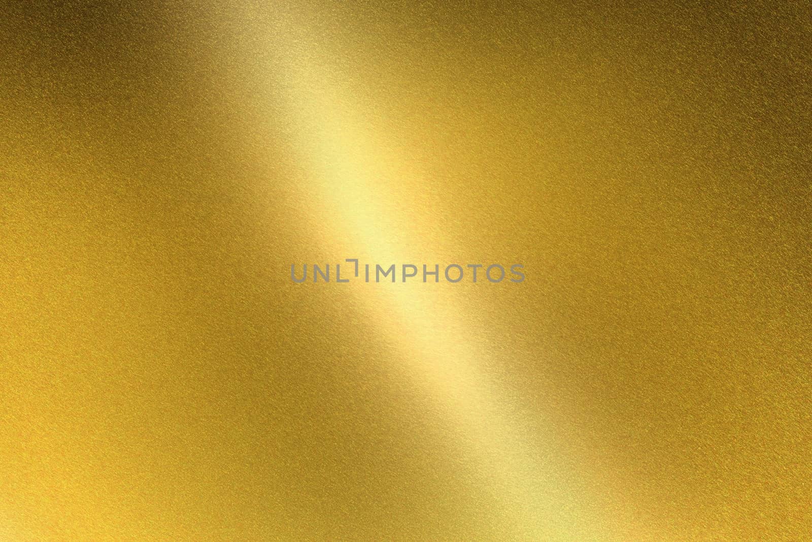 Light shining on gold metal sheet, abstract texture background