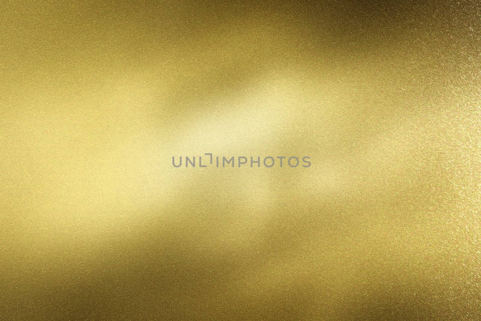 Light shining on gold metal sheet, abstract texture background