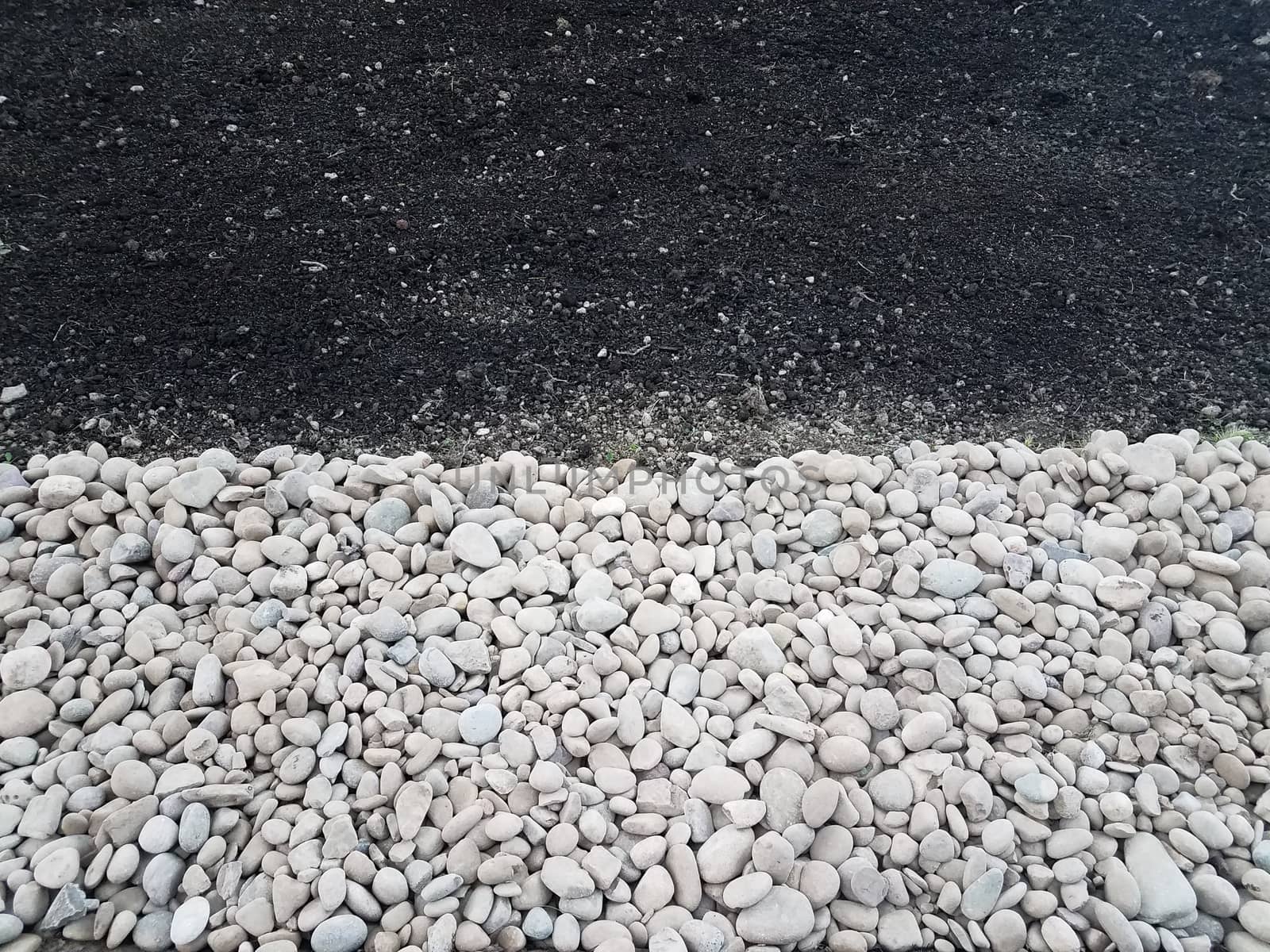 white and grey stones or rocks with brown dirt or soil