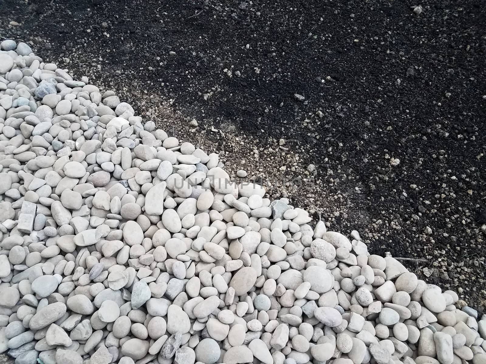 white and grey stones or rocks with brown dirt or soil