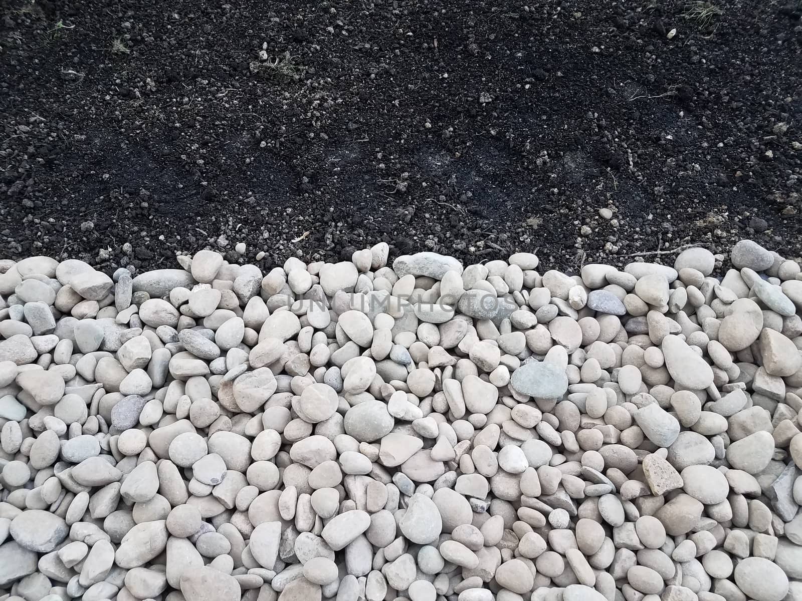 white and grey stones or rocks with brown dirt by stockphotofan1