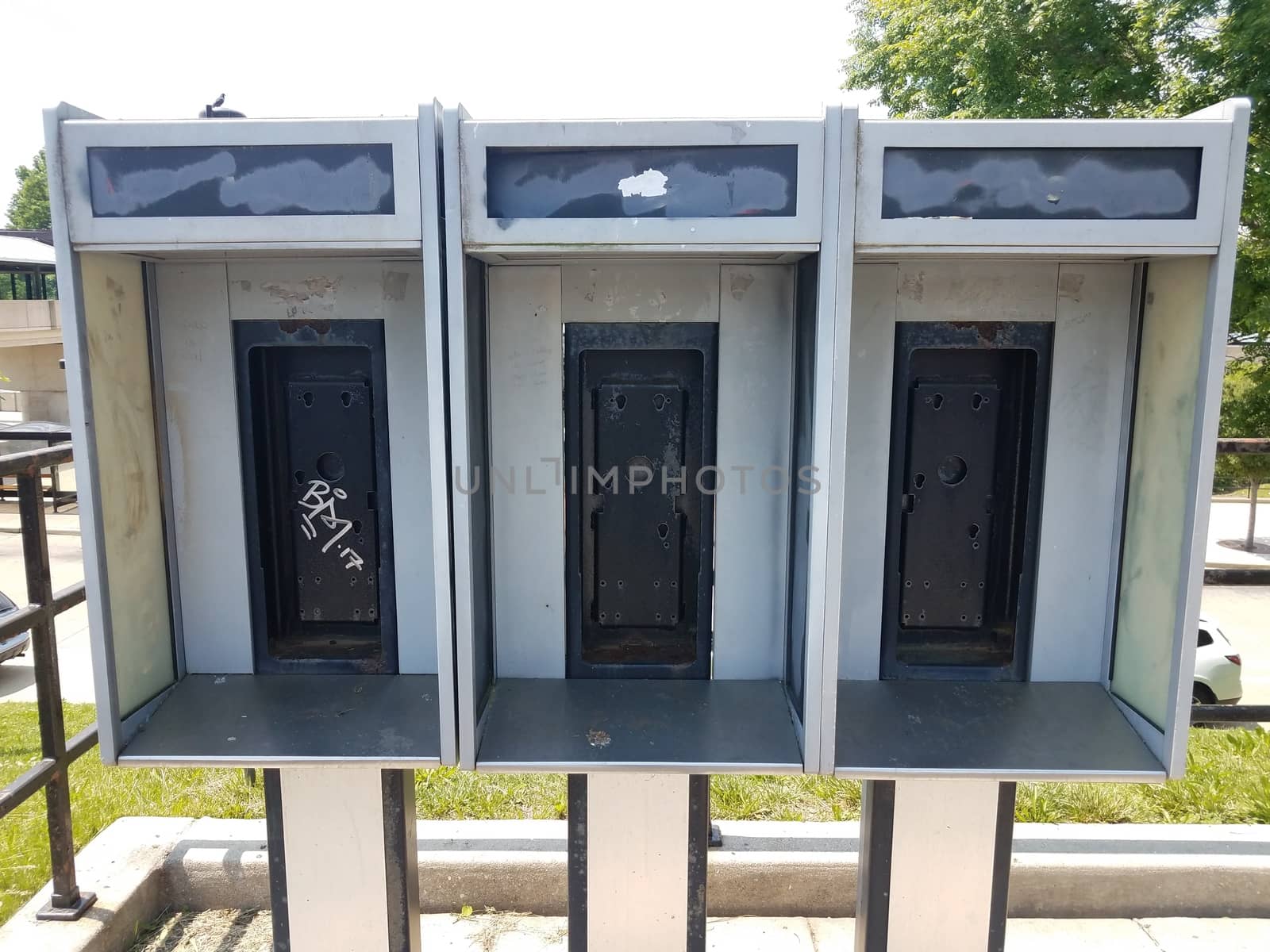 old phone booths worn and weathered with no phones