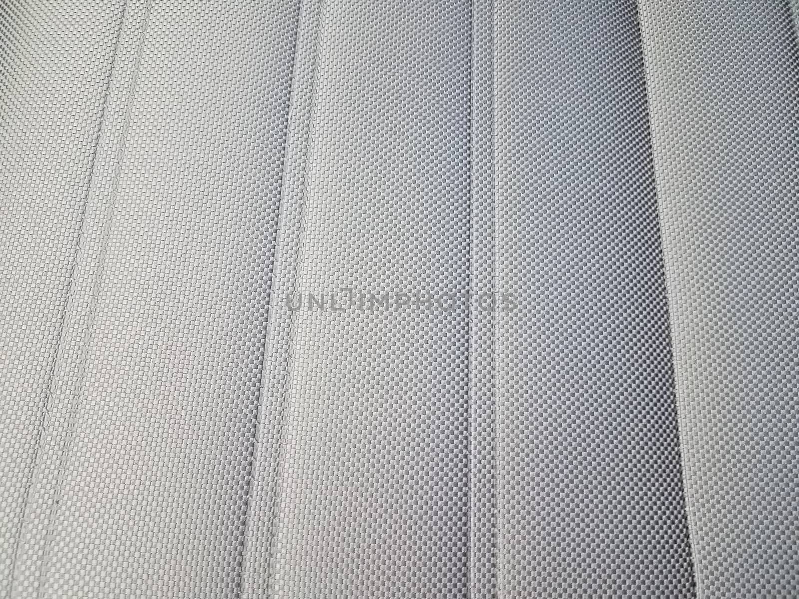 grey upholstery or fabric on seat or chair or background