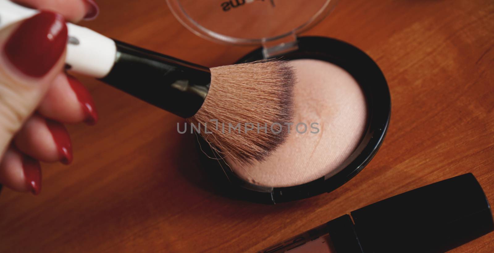 Decorative cosmetics on wooden background top and back view